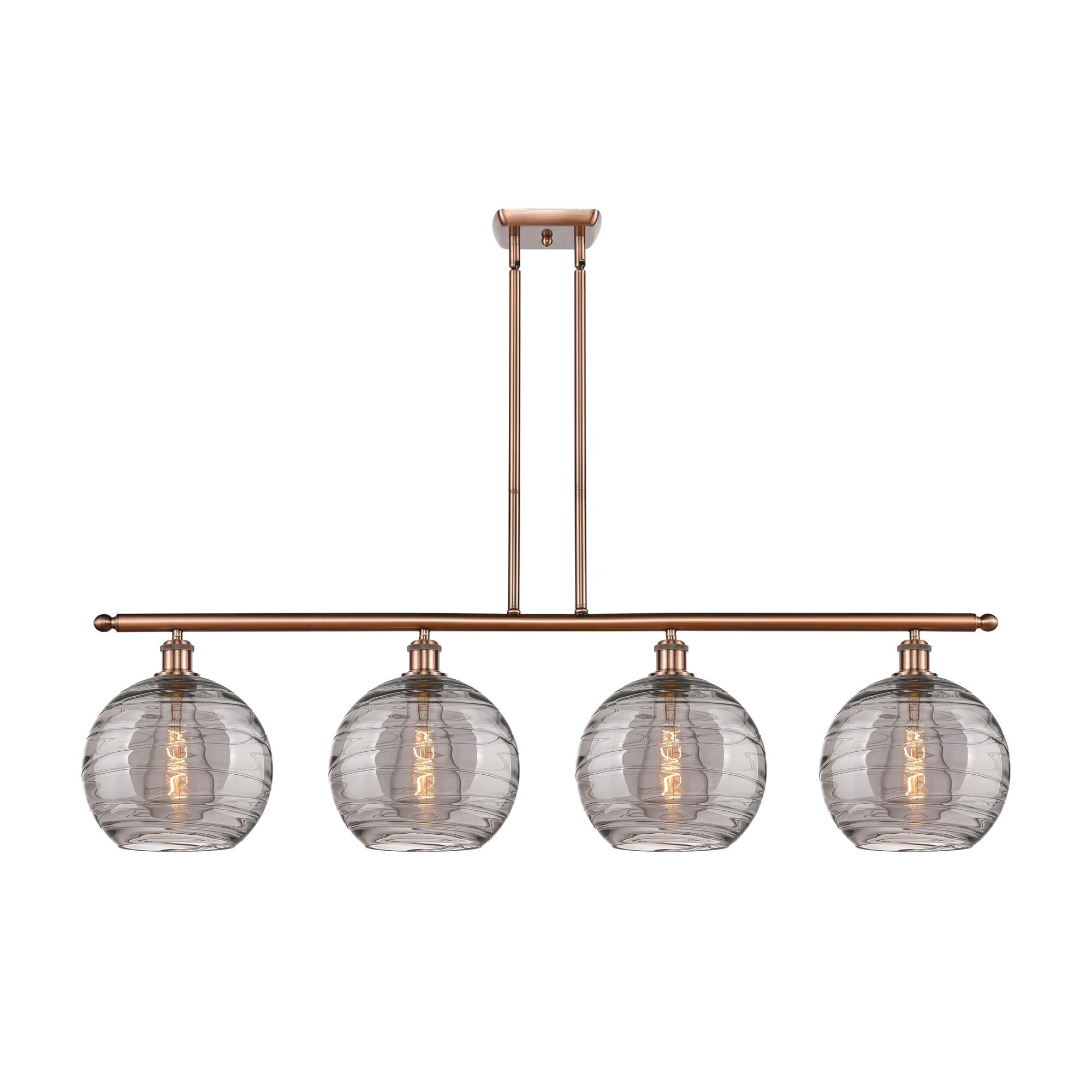 Shown in Antique Copper finish and Light Smoke Deco Swirl glass