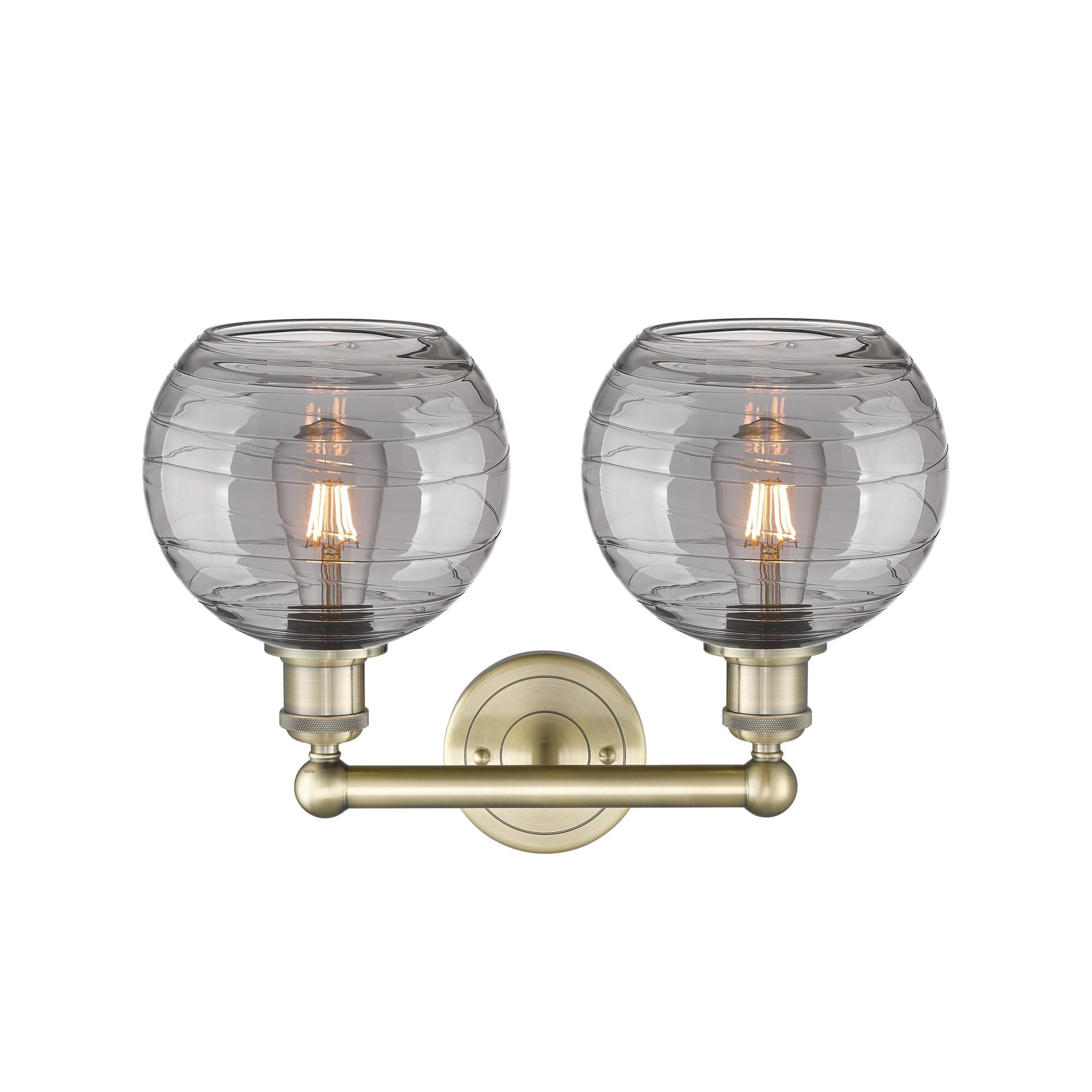 Shown in Antique Brass finish and Light Smoke Deco Swirl glass