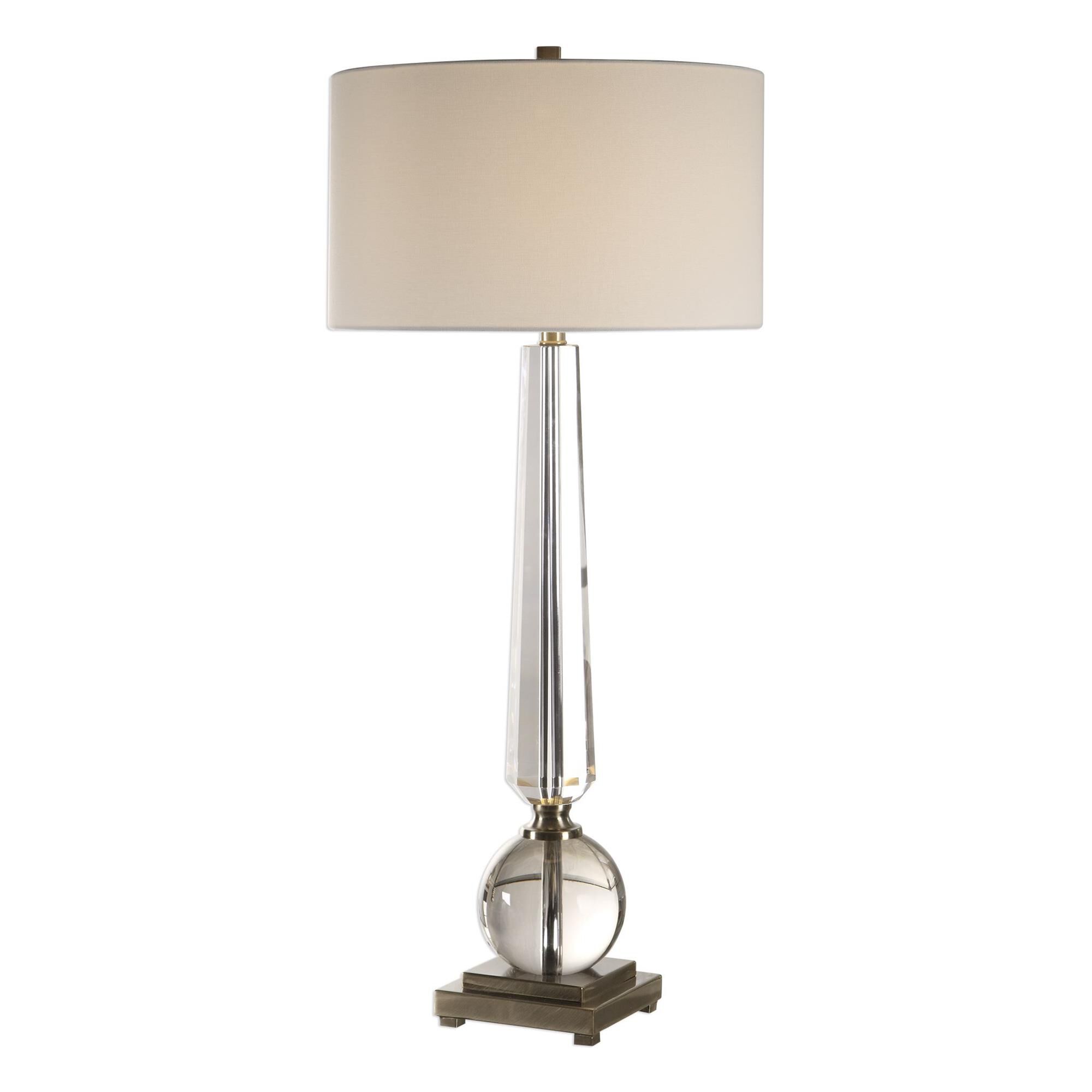 Shown in This Elegant Lamp Features A Tapered Cut Crystal Column, Displayed With A Thick Crystal Sphere, Crea finish and Round Hardback Drum shade
