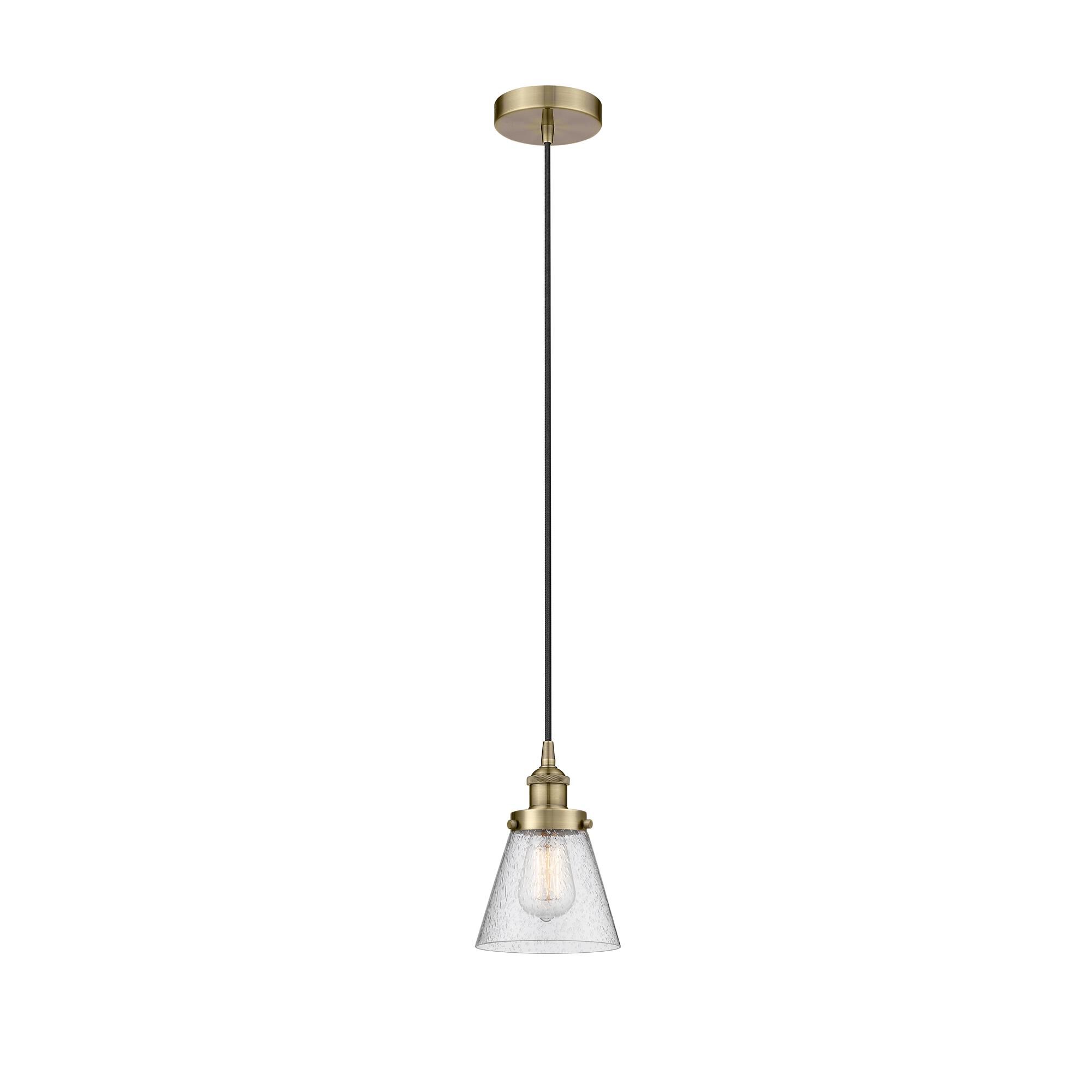 Shown in Antique Brass finish and Seedy Small Cone glass