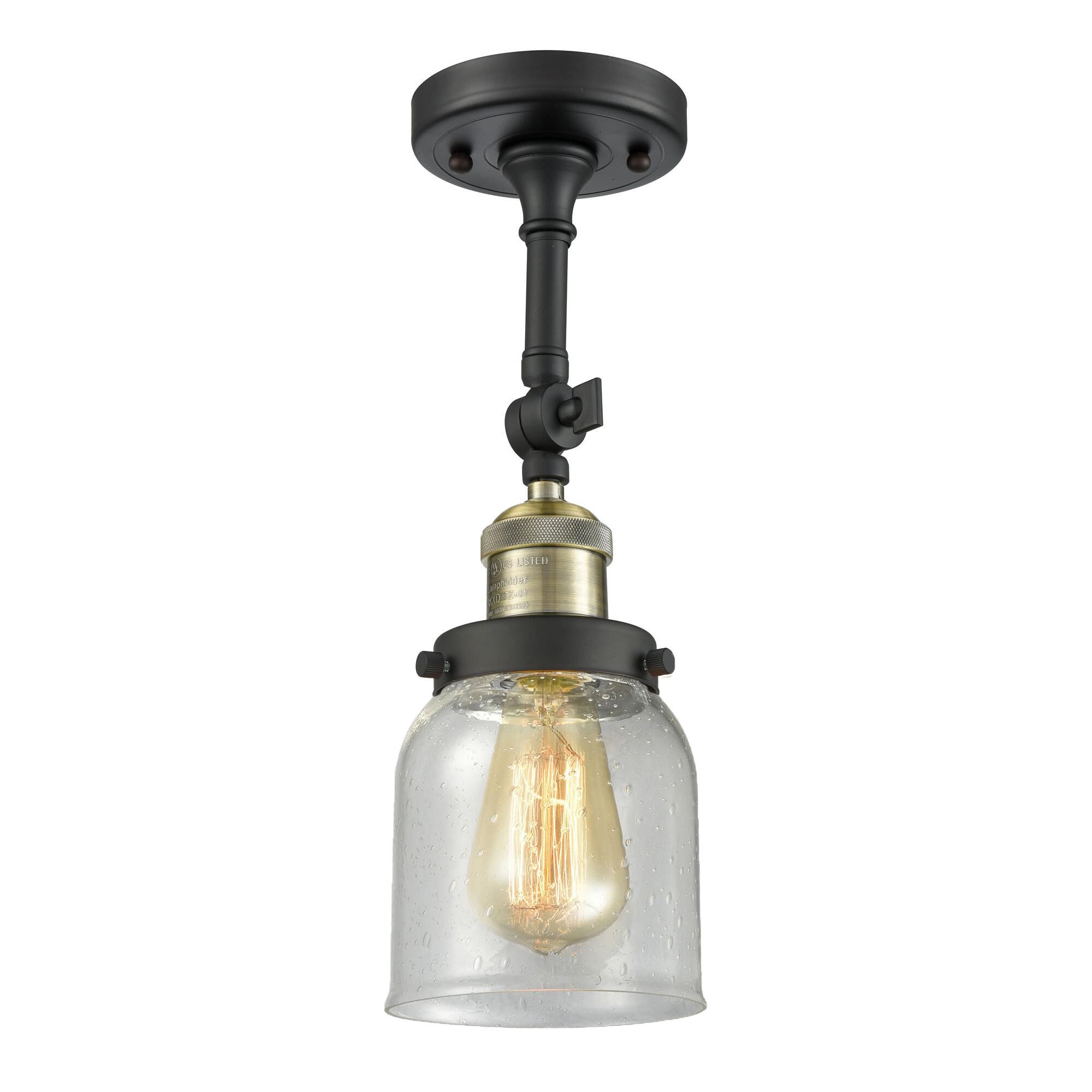 Shown in Black Antique Brass finish and Seedy glass and None accent