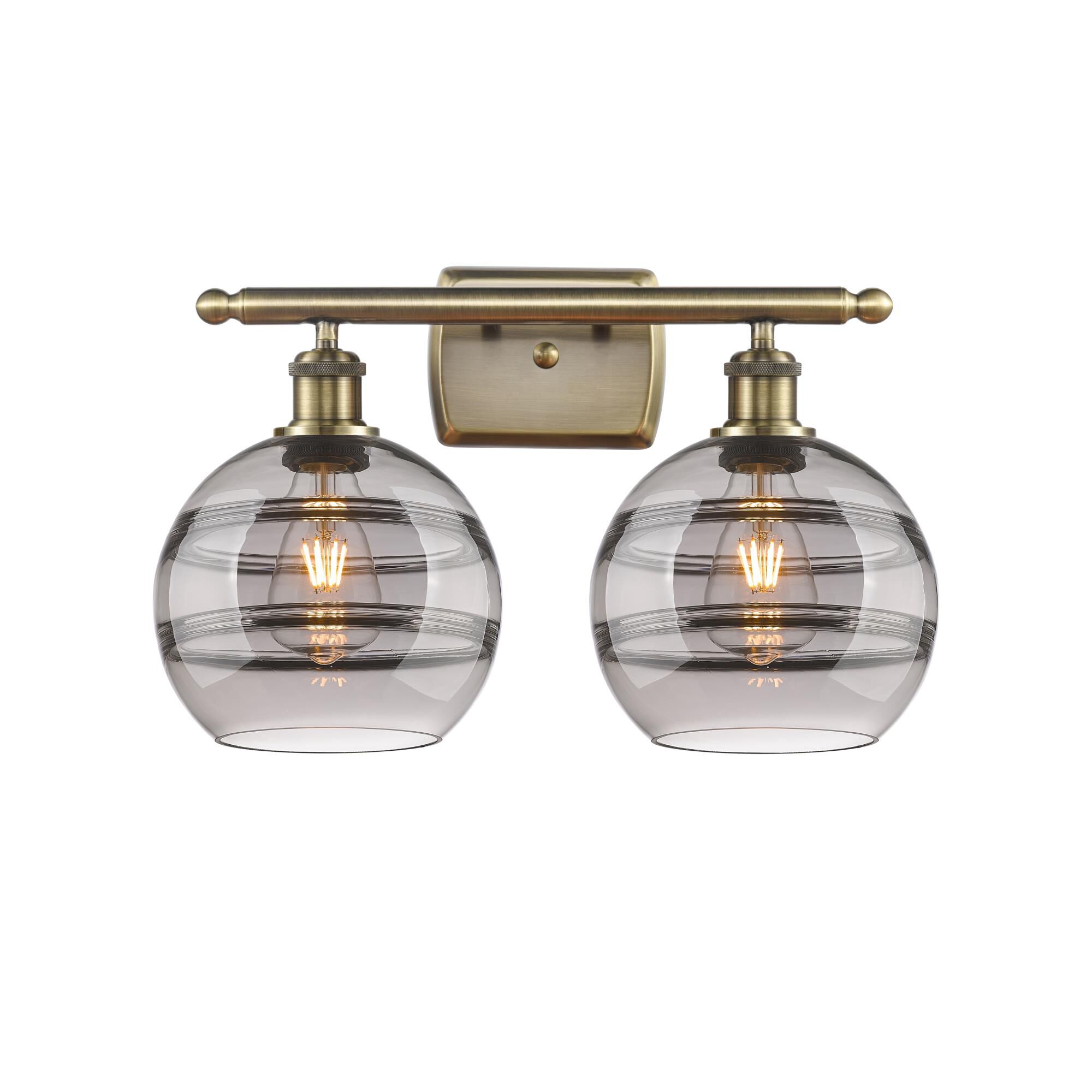 Shown in Antique Brass finish and Light Smoke glass