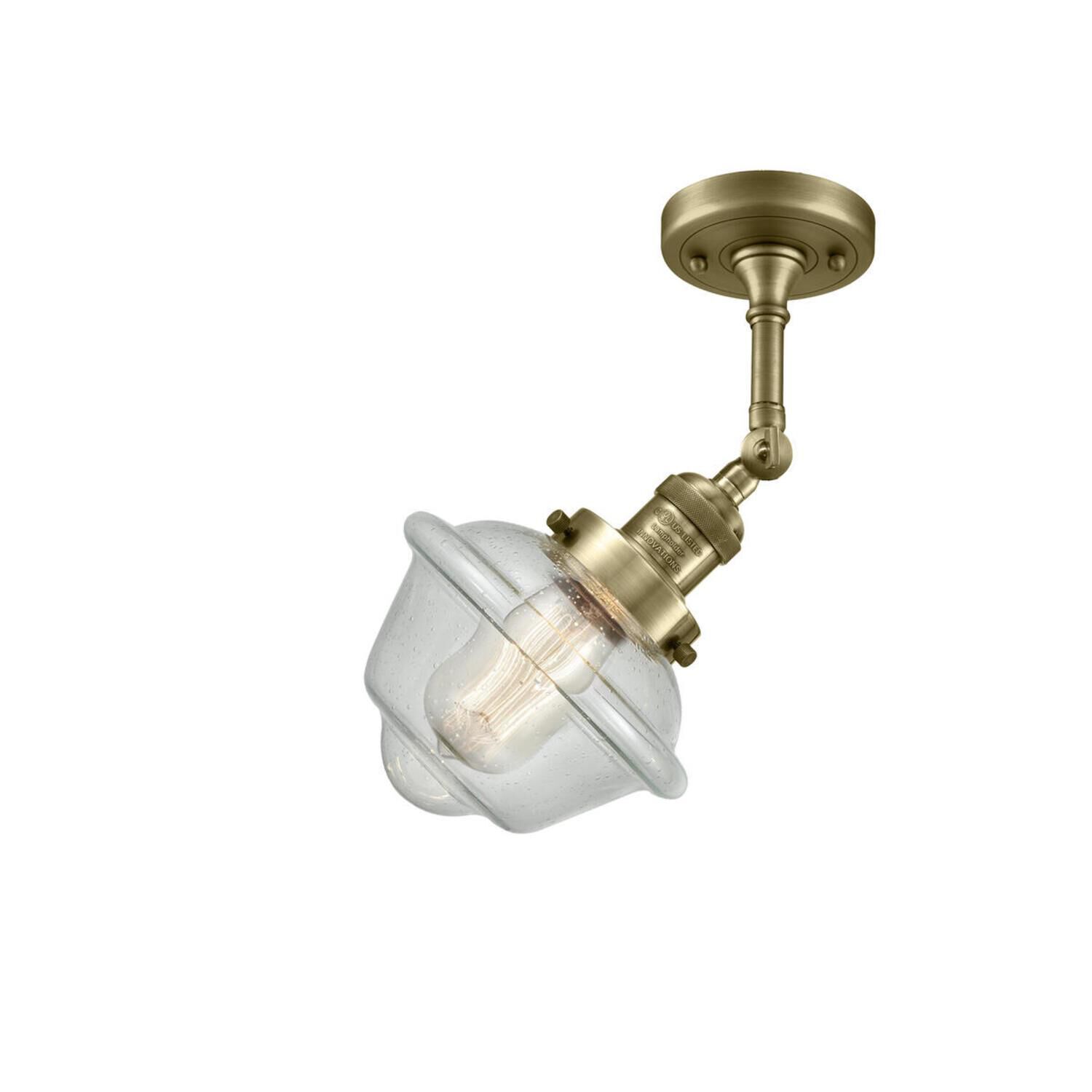 Shown in Antique Brass finish and Seedy glass