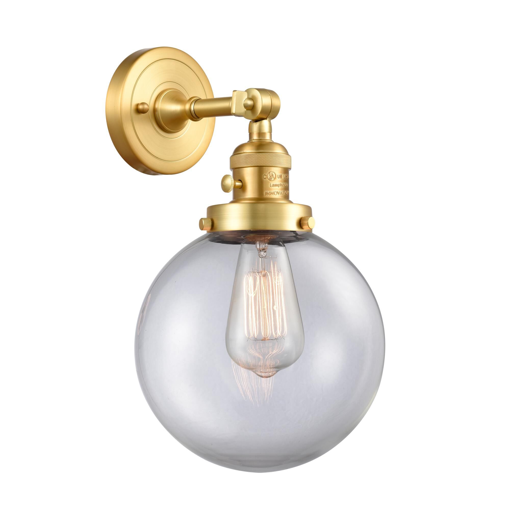 Shown in Satin Gold finish and Clear Beacon glass