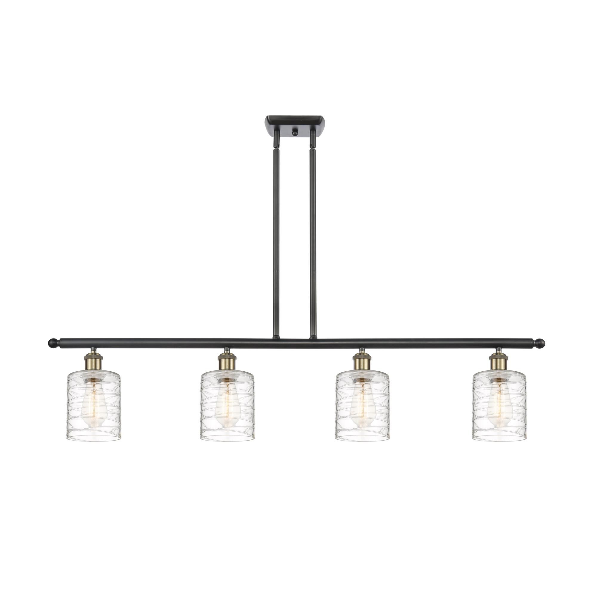 Shown in Black Antique Brass finish and Deco Swirl Cobbleskill glass