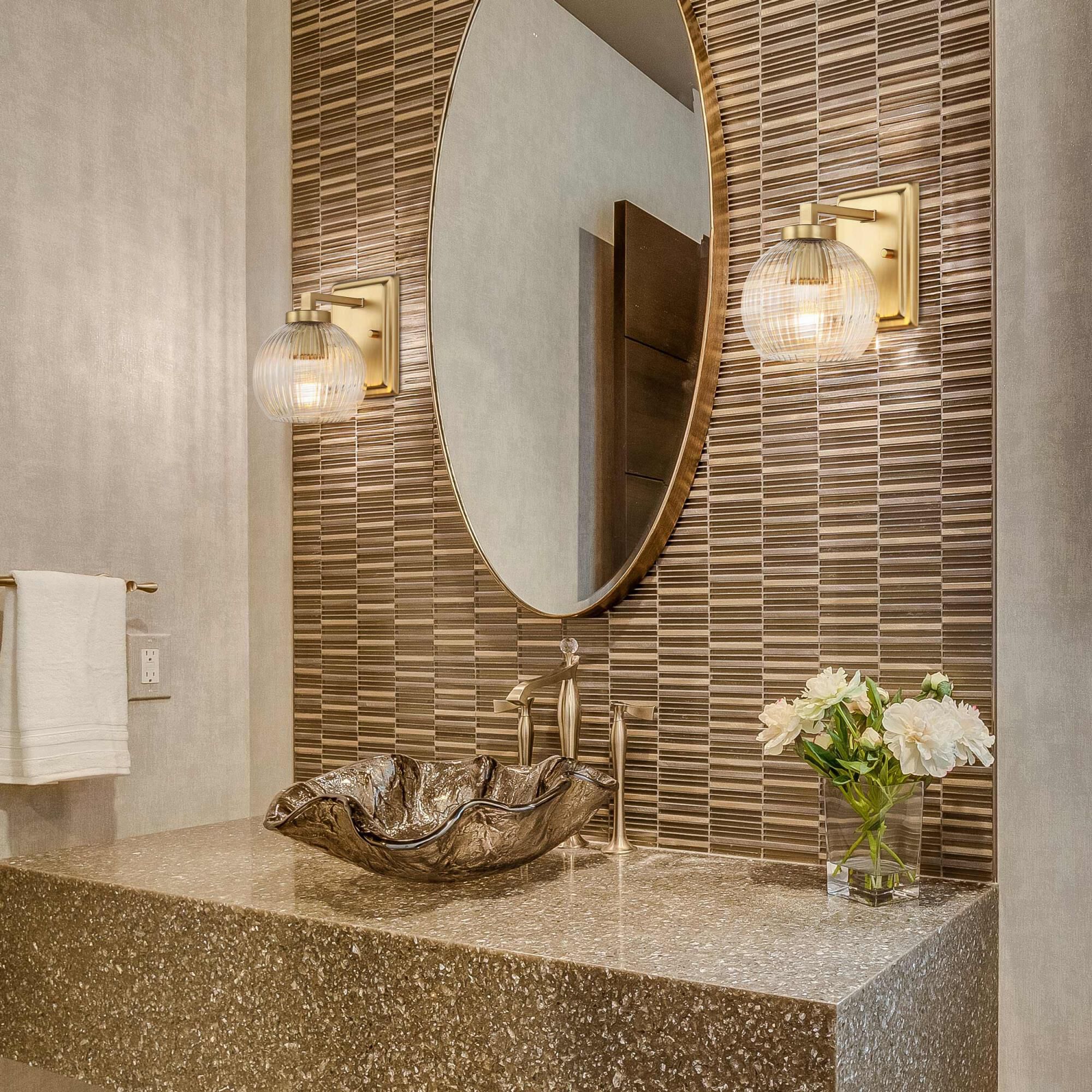 Shown in Brushed Champagne Bronze finish and Ribbed Clear Glass shade