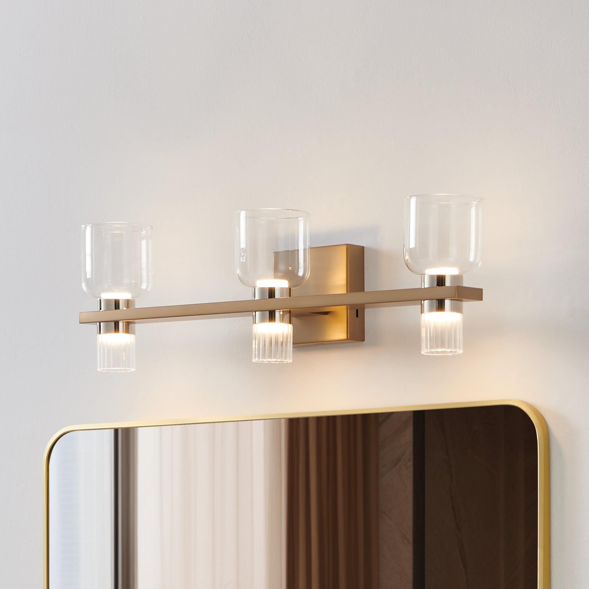 Shown in Champagne Gold finish and Clear, Clear Ribbed glass