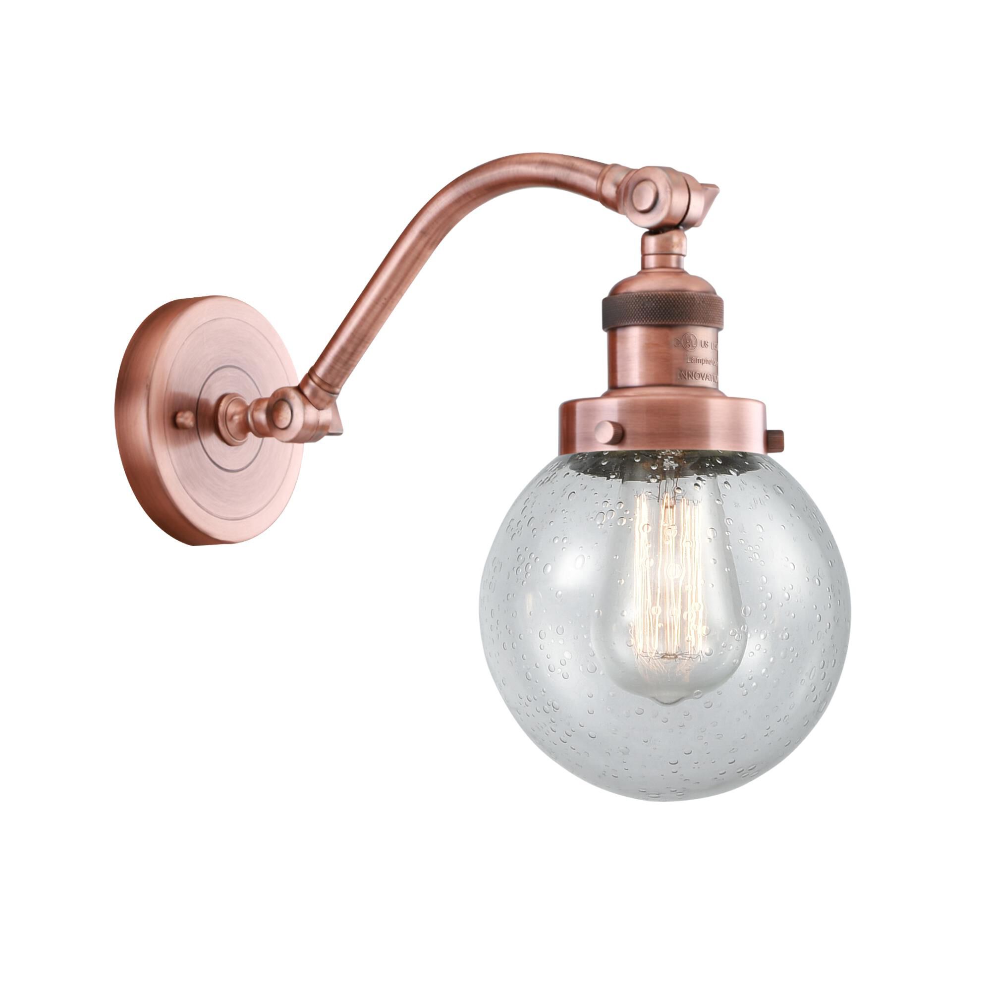 Shown in Antique Copper finish and Seedy Beacon glass