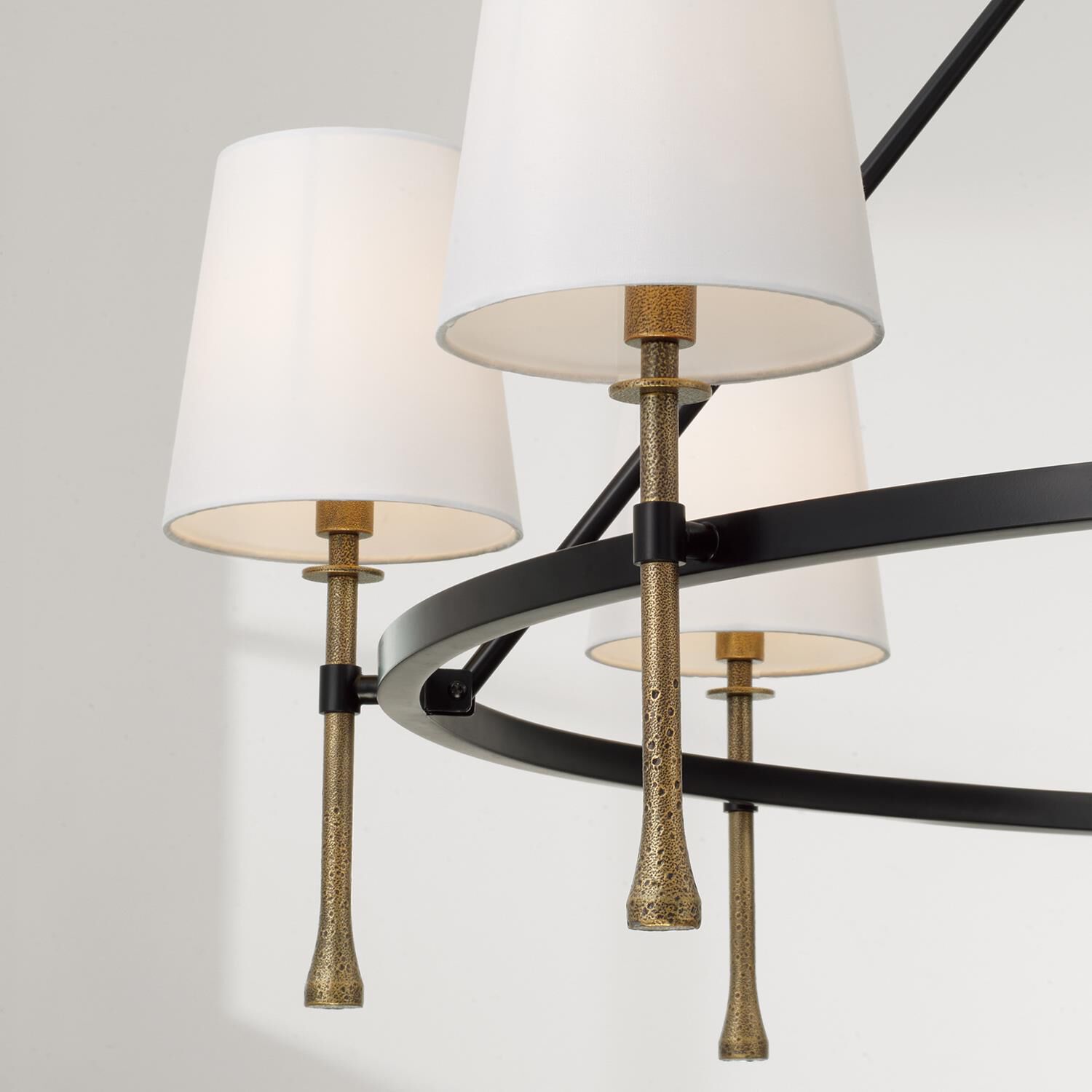 Shown in Matte Black With Hammered Gold finish and White Fabric Stay-Straight s shade