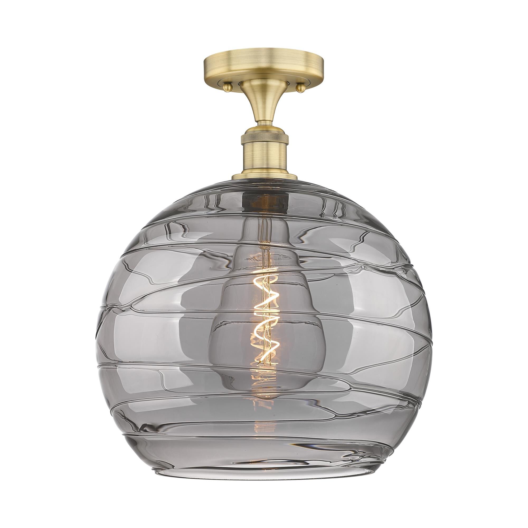 Shown in Brushed Brass finish and Light Smoke Deco Swirl glass