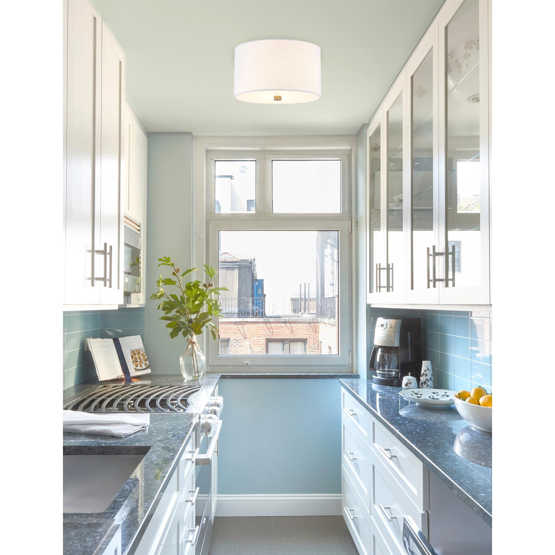 Shown in Brushed Brass finish and White Woven Fabric shade