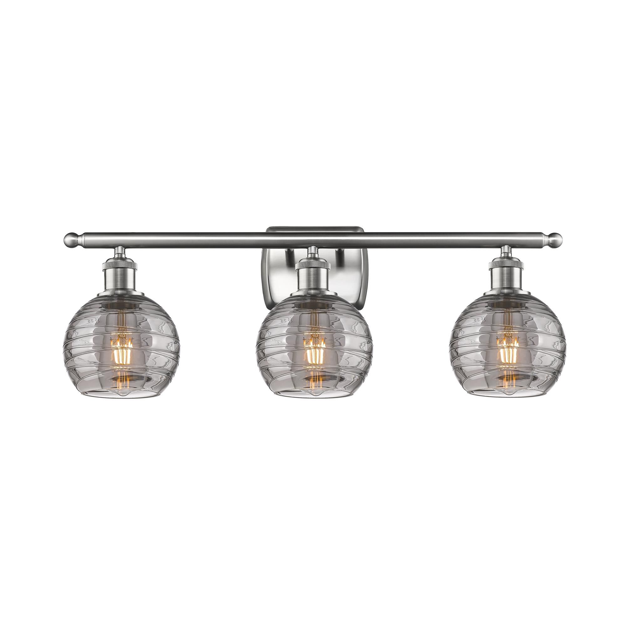 Shown in Brushed Satin Nickel finish and Light Smoke Deco Swirl glass