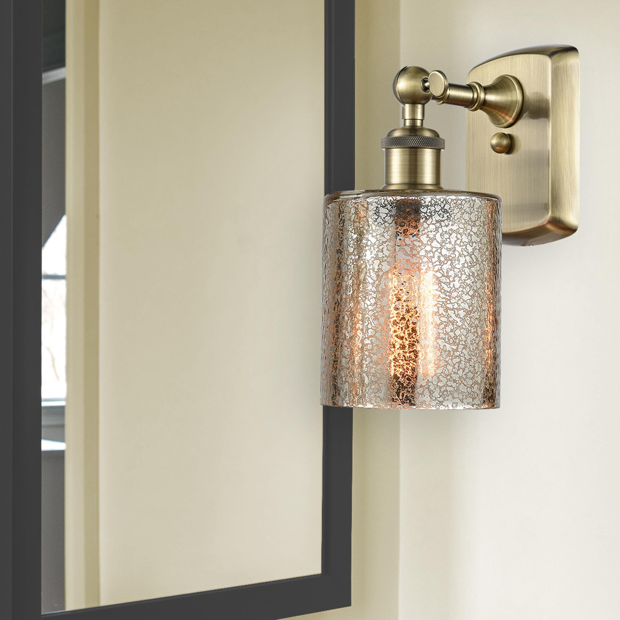 Shown in Antique Brass finish and Mercury Cobbleskill glass and None shade
