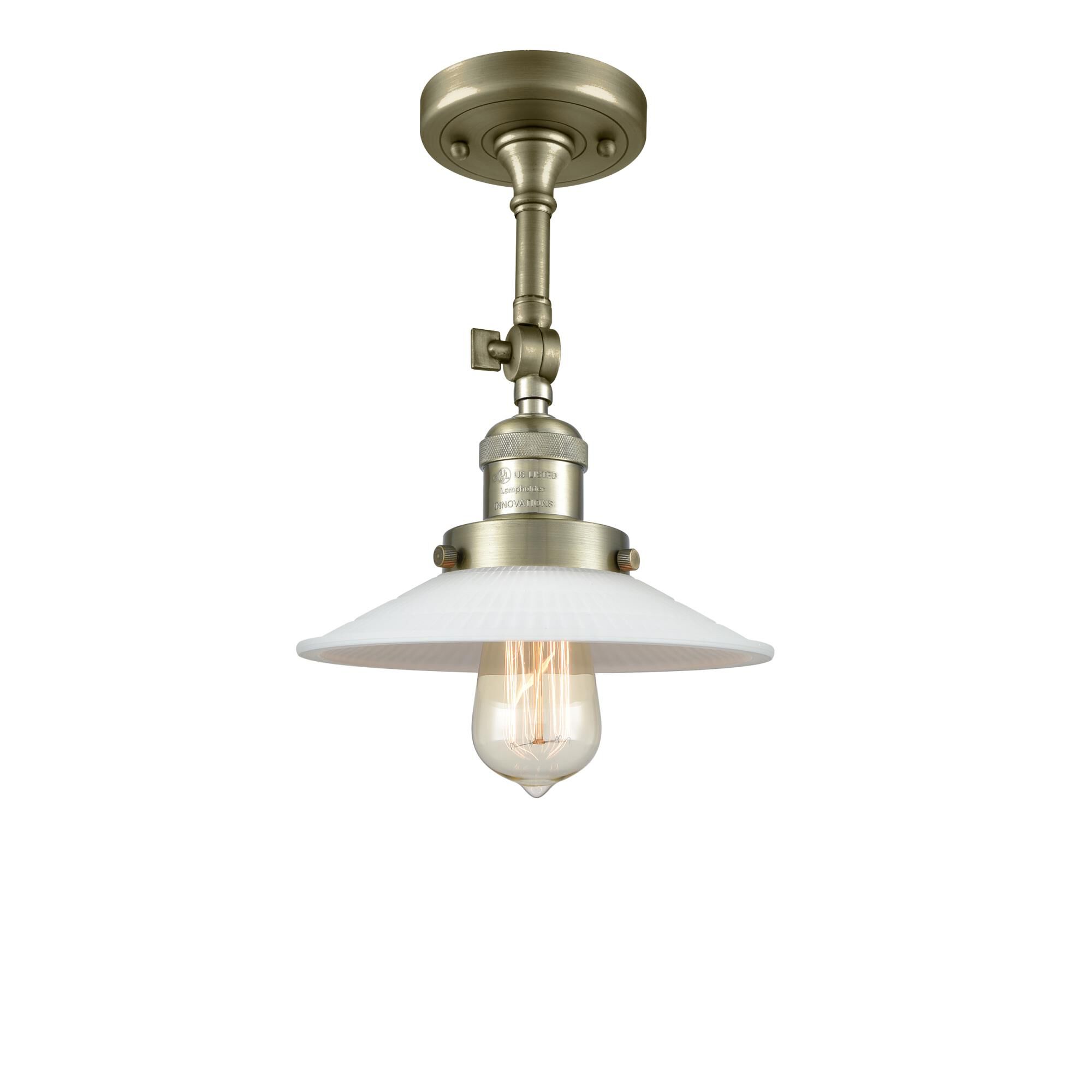 Shown in Antique Brass finish and Matte White Halophane - Cone glass