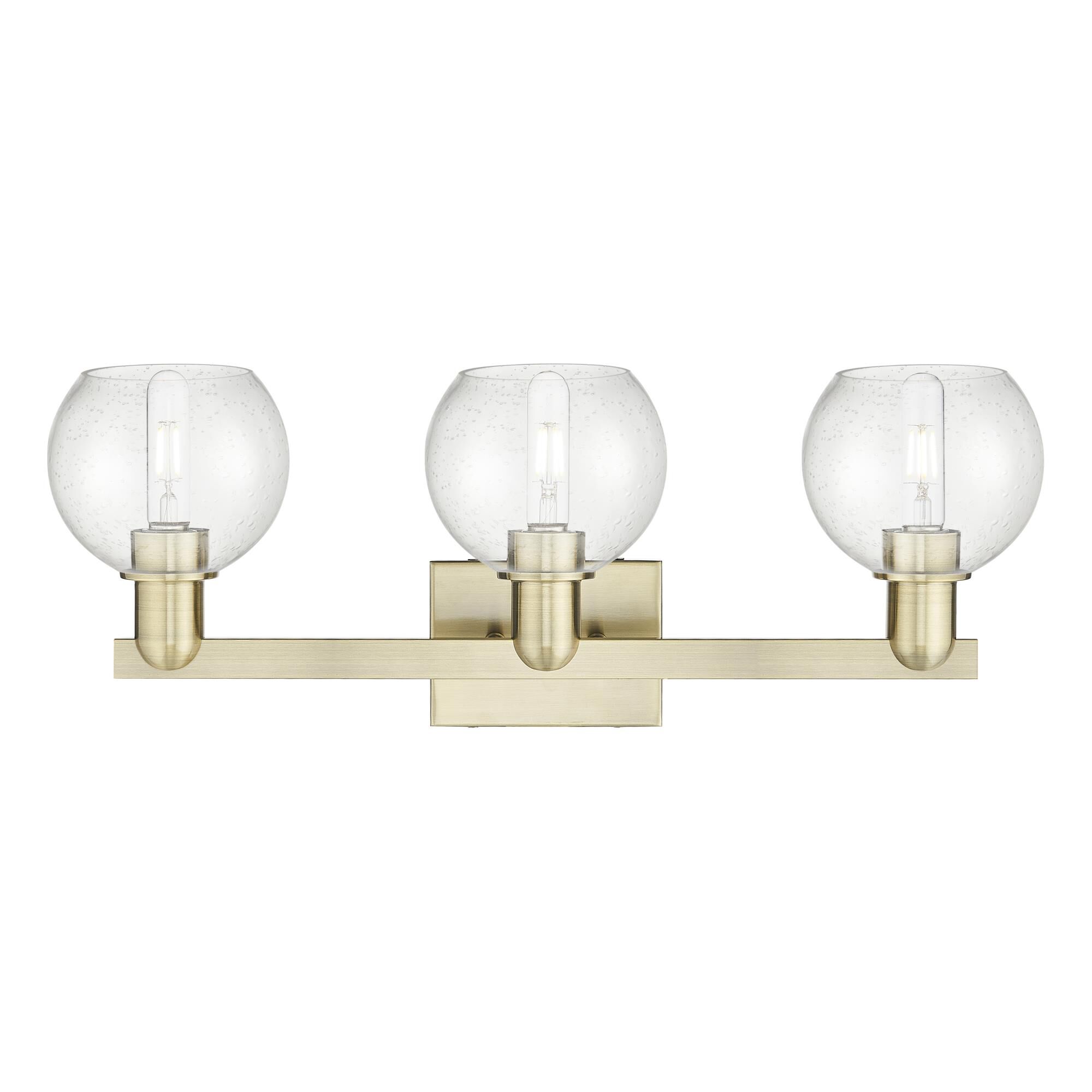 Shown in Antique Brass finish and Seedy glass