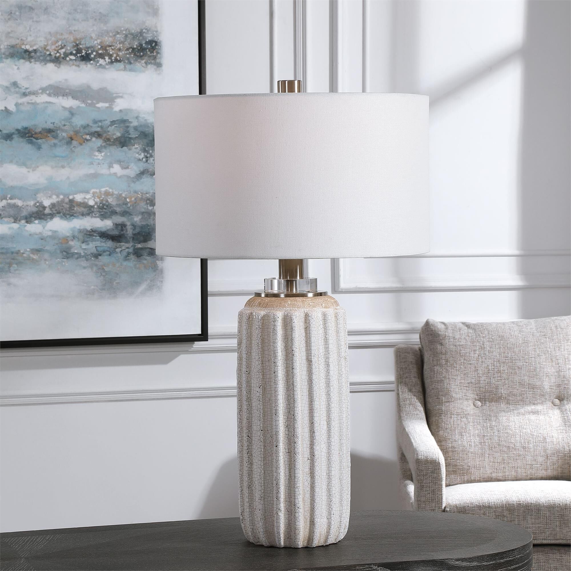 Shown in A Nod To Old World Style, This Ceramic Table Lamp Features A Distressed Cream And Beige Crackle Glaz finish and Round Hardback Drum shade