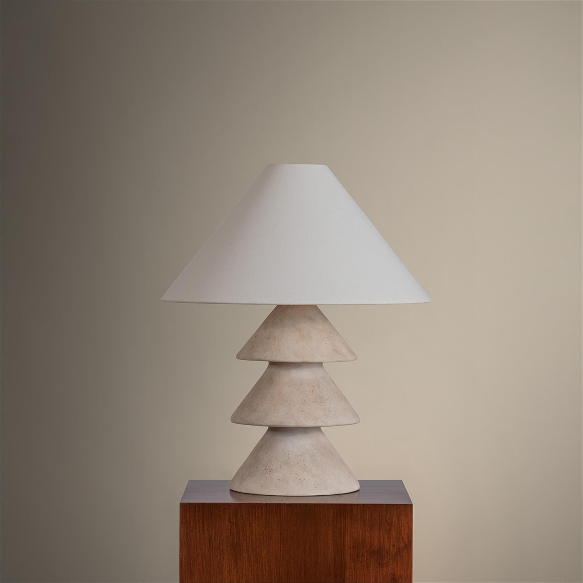 Shown in Patina Brass finish and Off White Linen shade