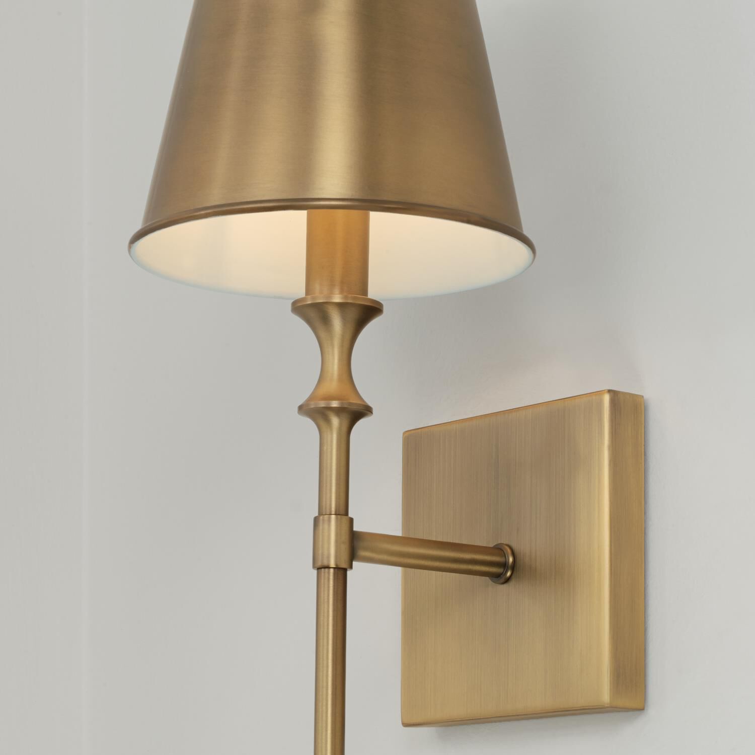 Shown in Aged Brass finish and Aged Brass Metal Stay-Straight  with White Interior shade