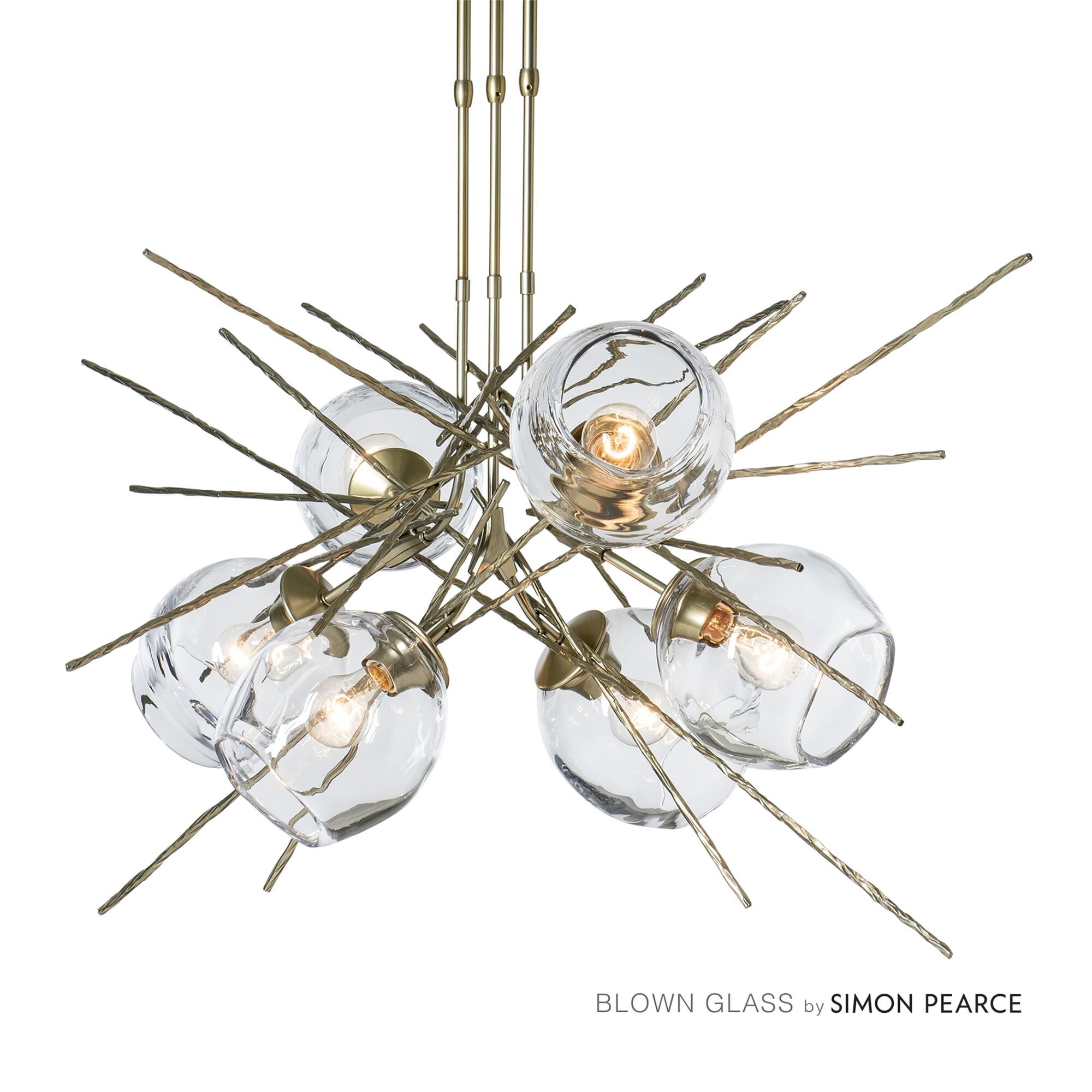 Shown in Modern Brass finish and Clear shade