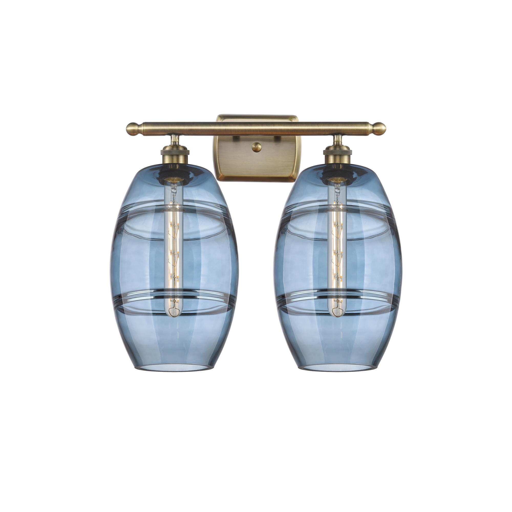 Shown in Antique Brass finish and Princess Blue glass