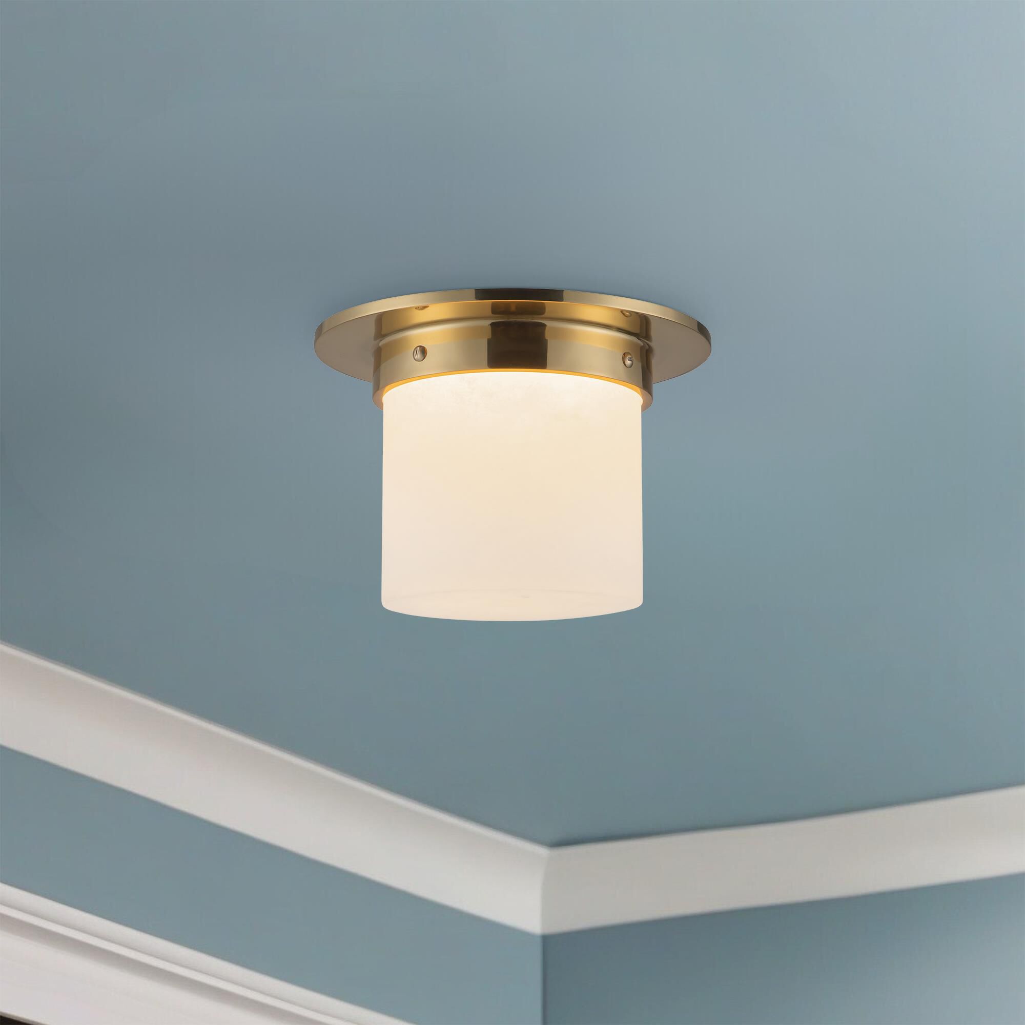 Shown in Patina Brass finish and Alabaster glass