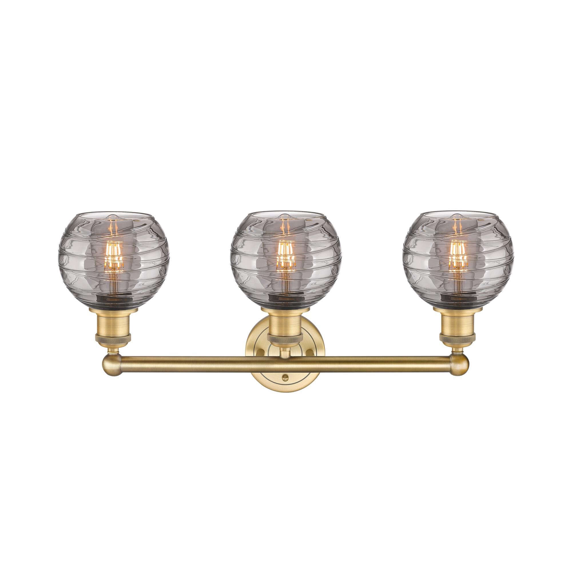 Shown in Brushed Brass finish and Light Smoke Deco Swirl glass