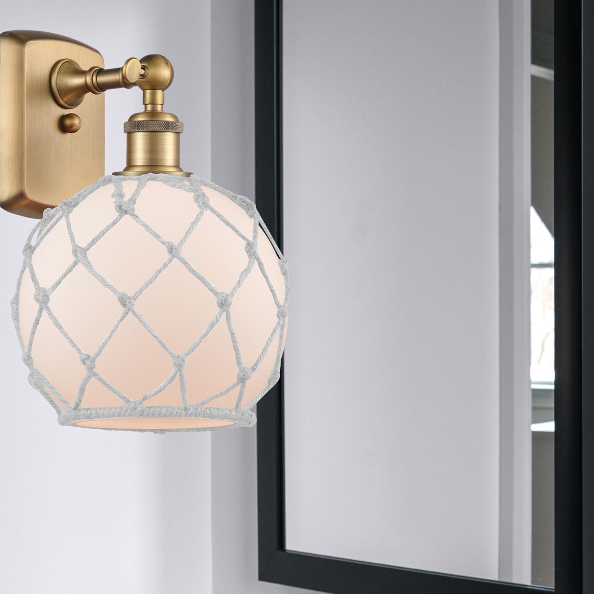 Shown in Brushed Brass finish and Sphere glass and Glass And Rope shade