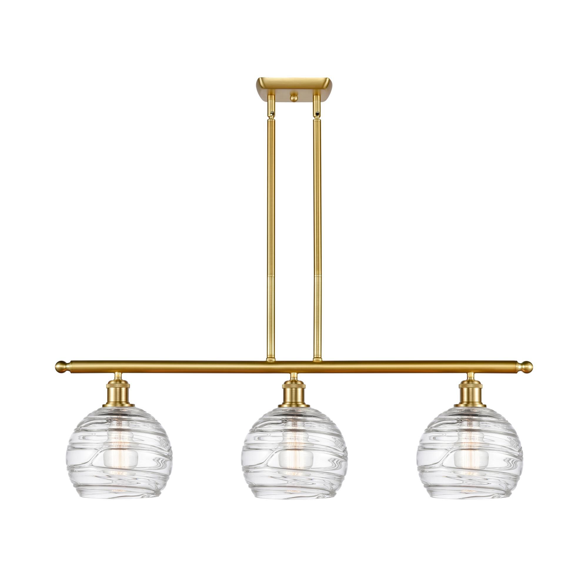 Shown in Satin Gold finish and Clear Deco Swirl glass