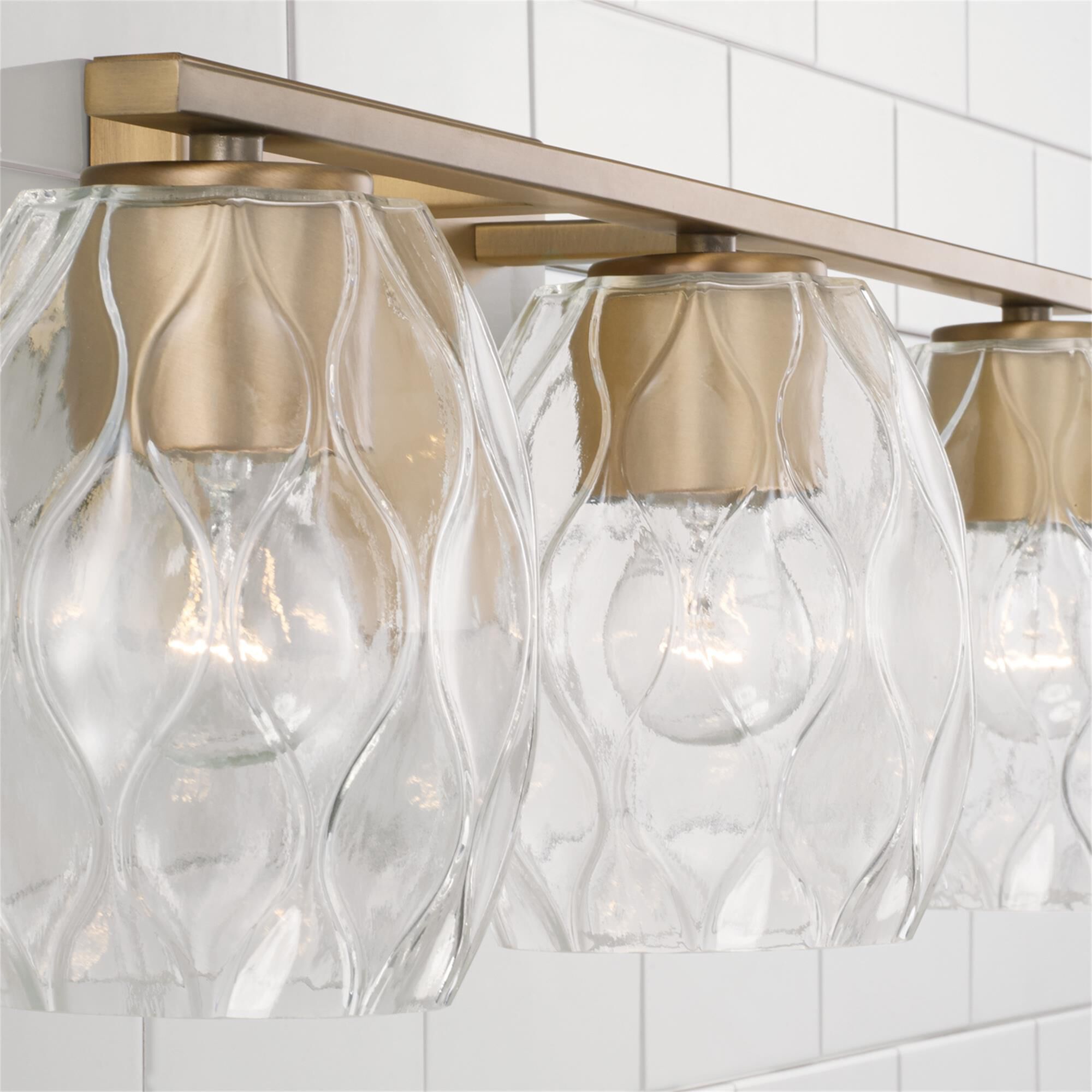 Shown in Aged Brass finish and Wavy Embossed glass