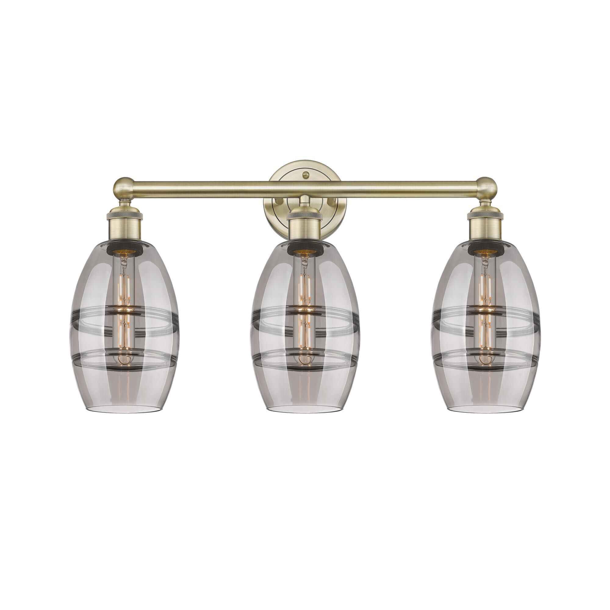Shown in Antique Brass finish and Light Smoke glass