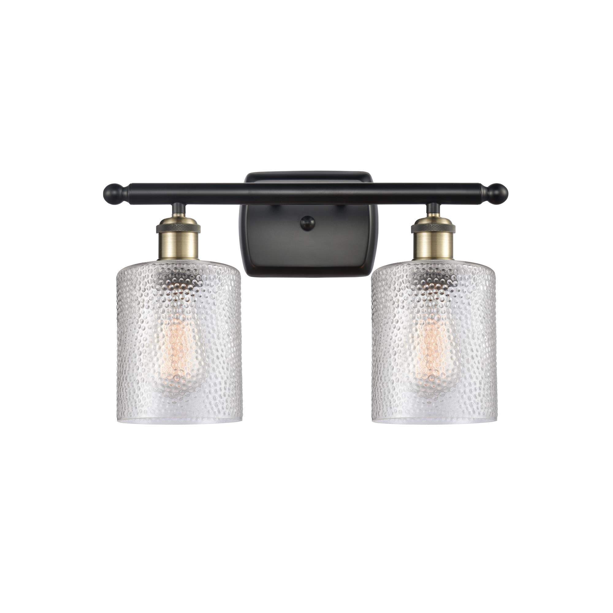 Shown in Black Antique Brass finish and Drum glass and Glass shade and Polished Chrome accent