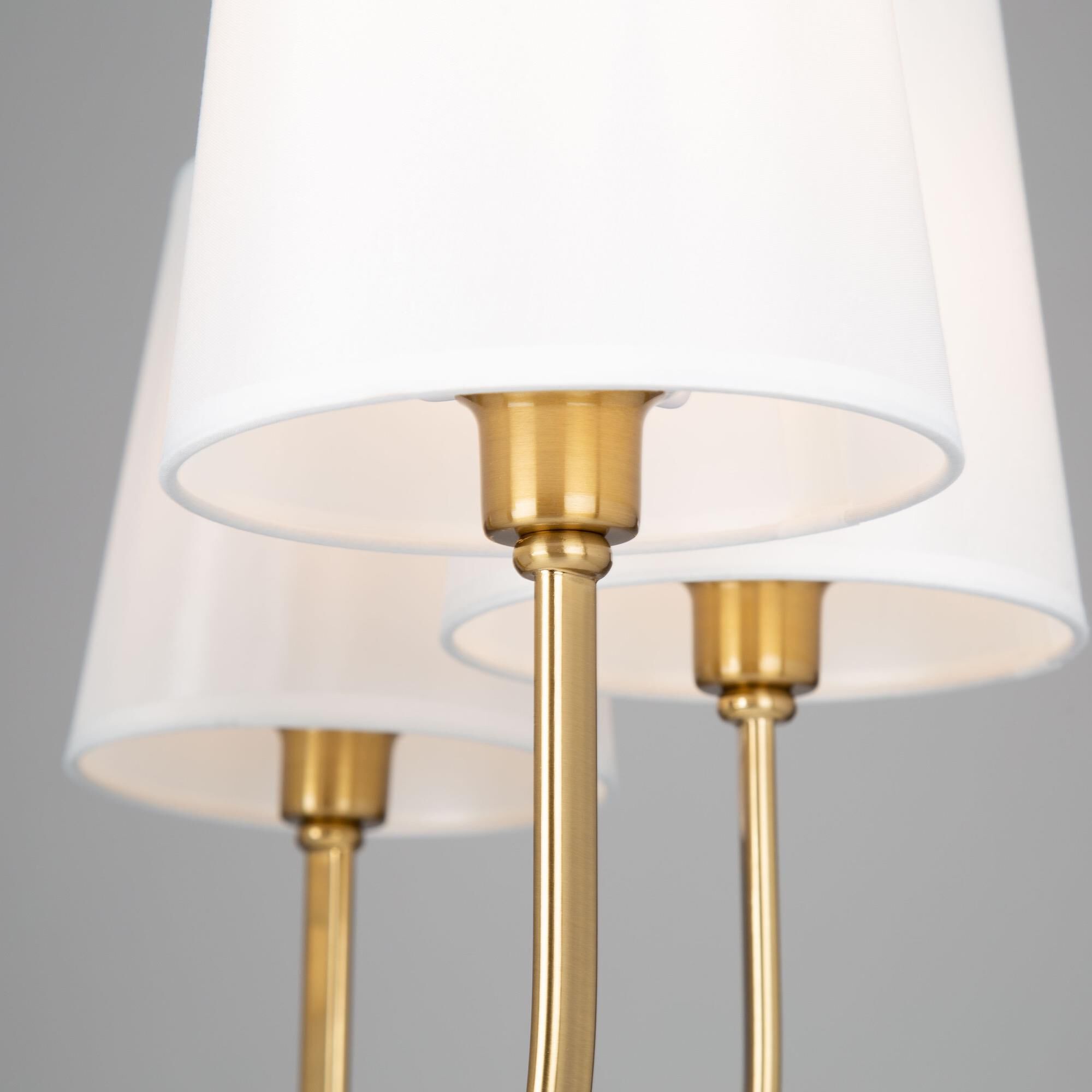 Shown in Brushed Gold finish and White Linen shade