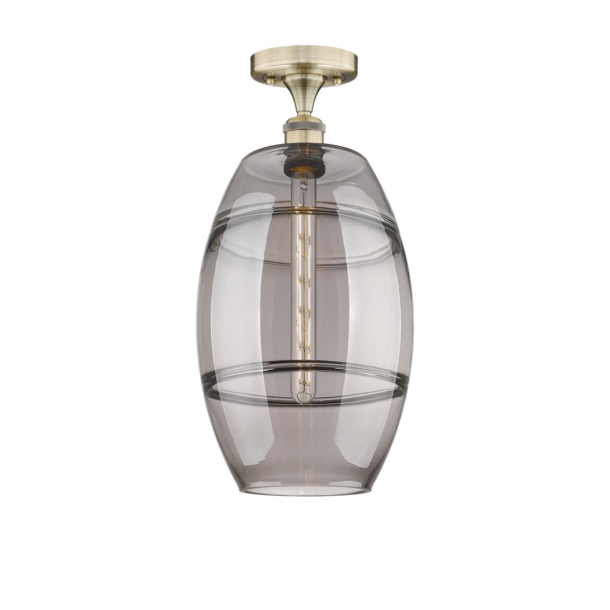 Shown in Antique Brass finish and Light Smoke glass