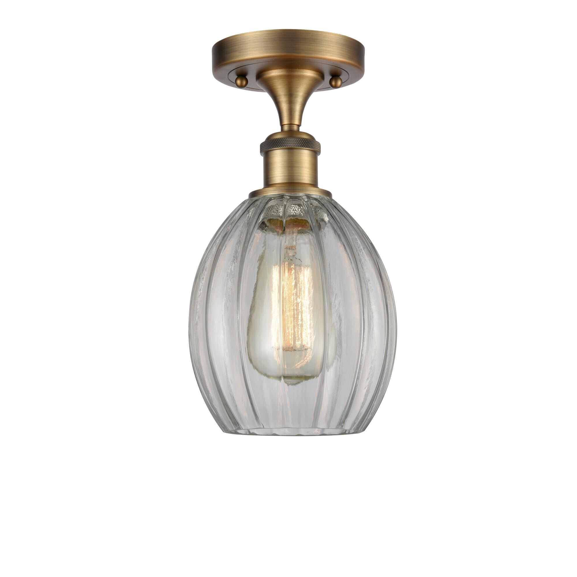 Shown in Brushed Brass finish and Sphere glass and Glass shade
