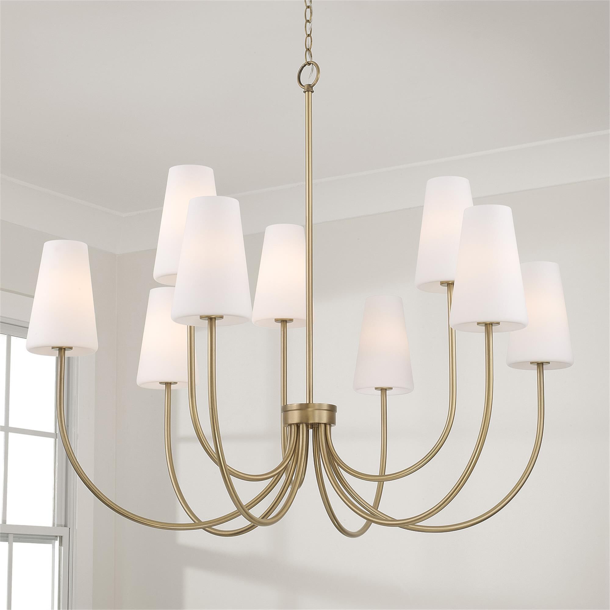 Shown in Aged Brass finish and Soft White glass