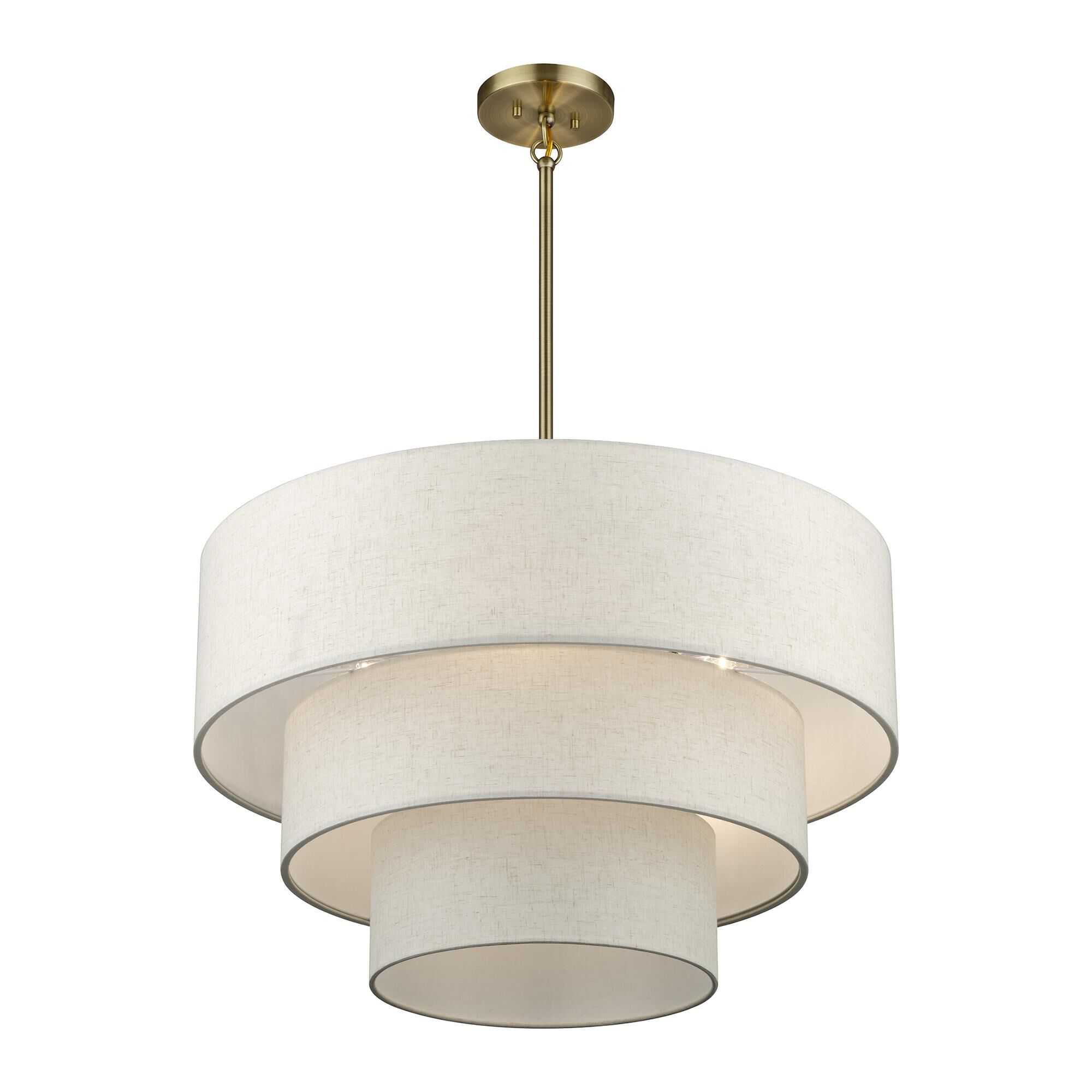 Shown in Antique Brass finish and Hand Crafted Oatmeal Color Fabric with White Color Inside shade