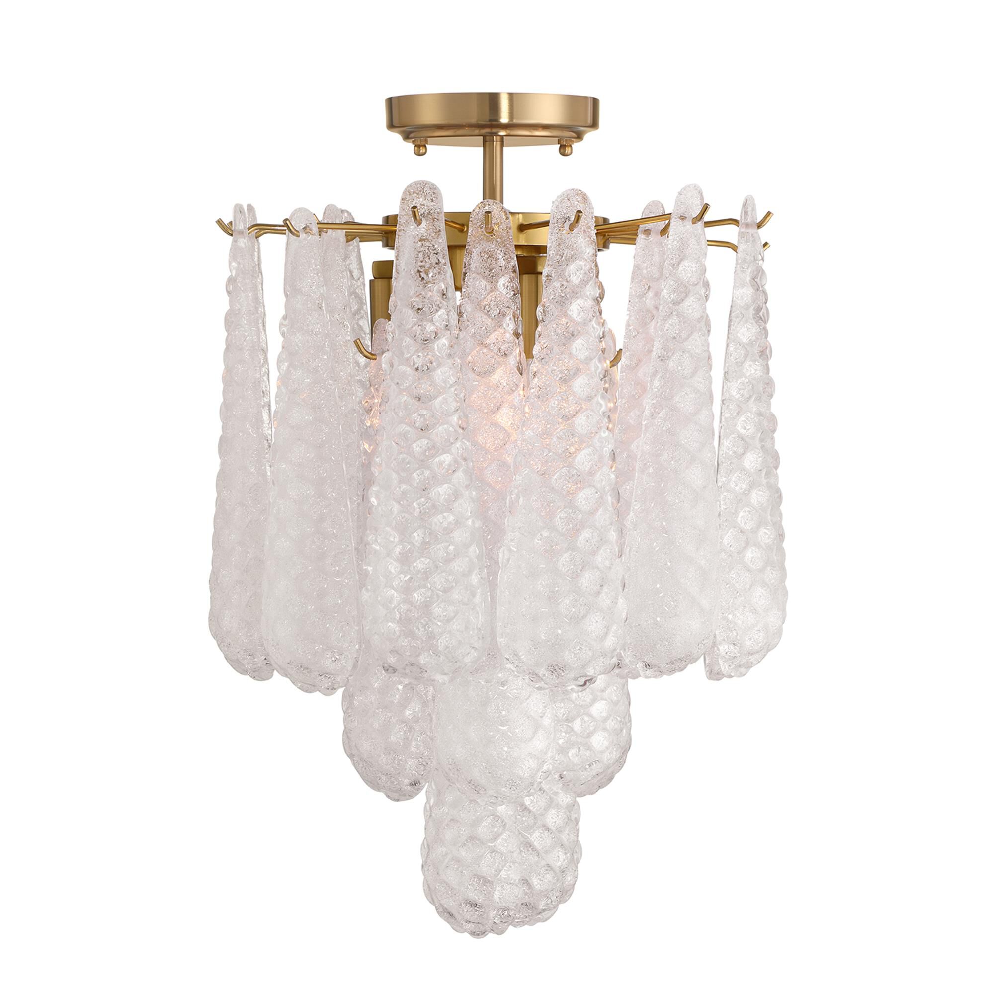 Shown in Aged Brass finish and Sand Clear glass
