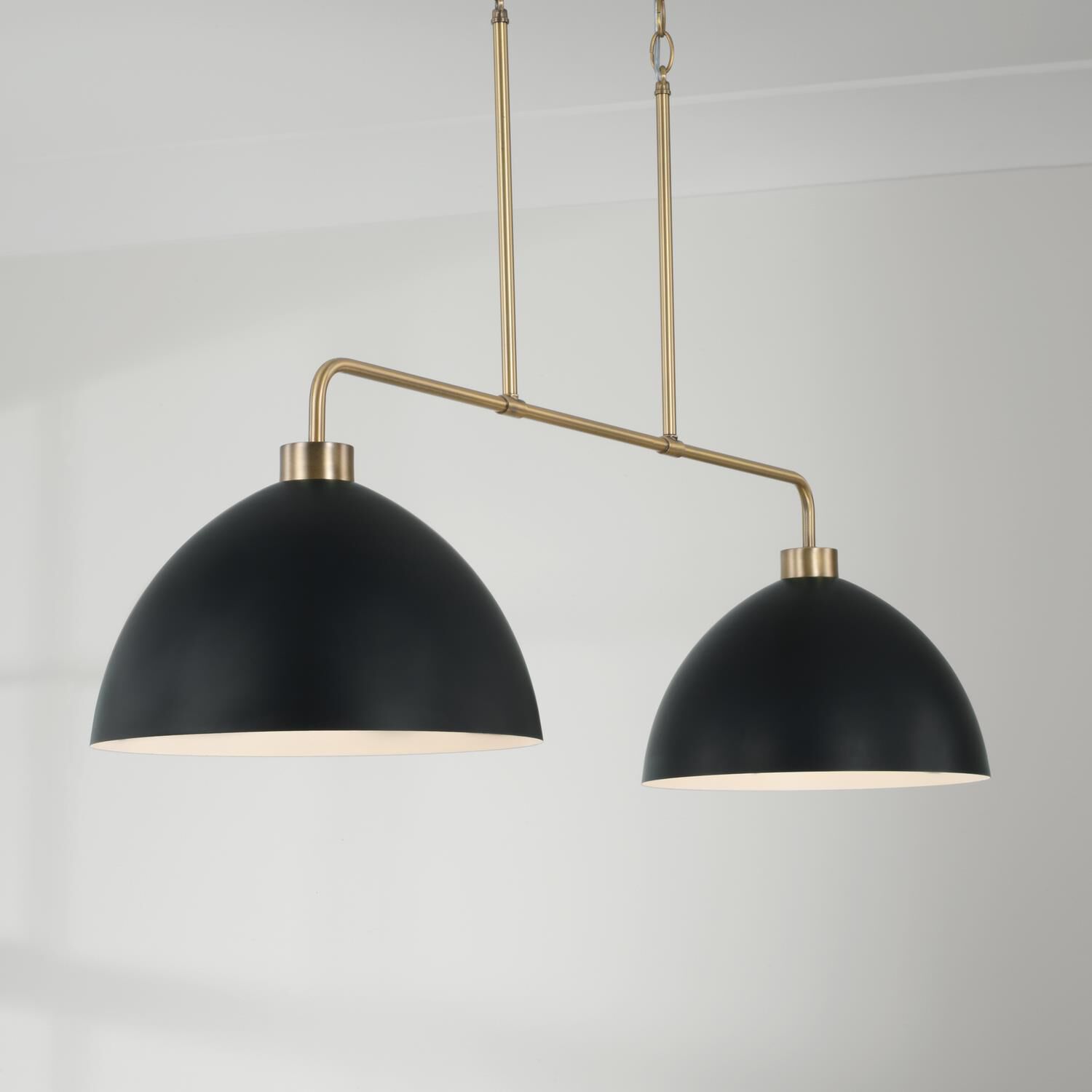 Shown in Aged Brass And Black finish and Matte Black Metal s With White Interior shade