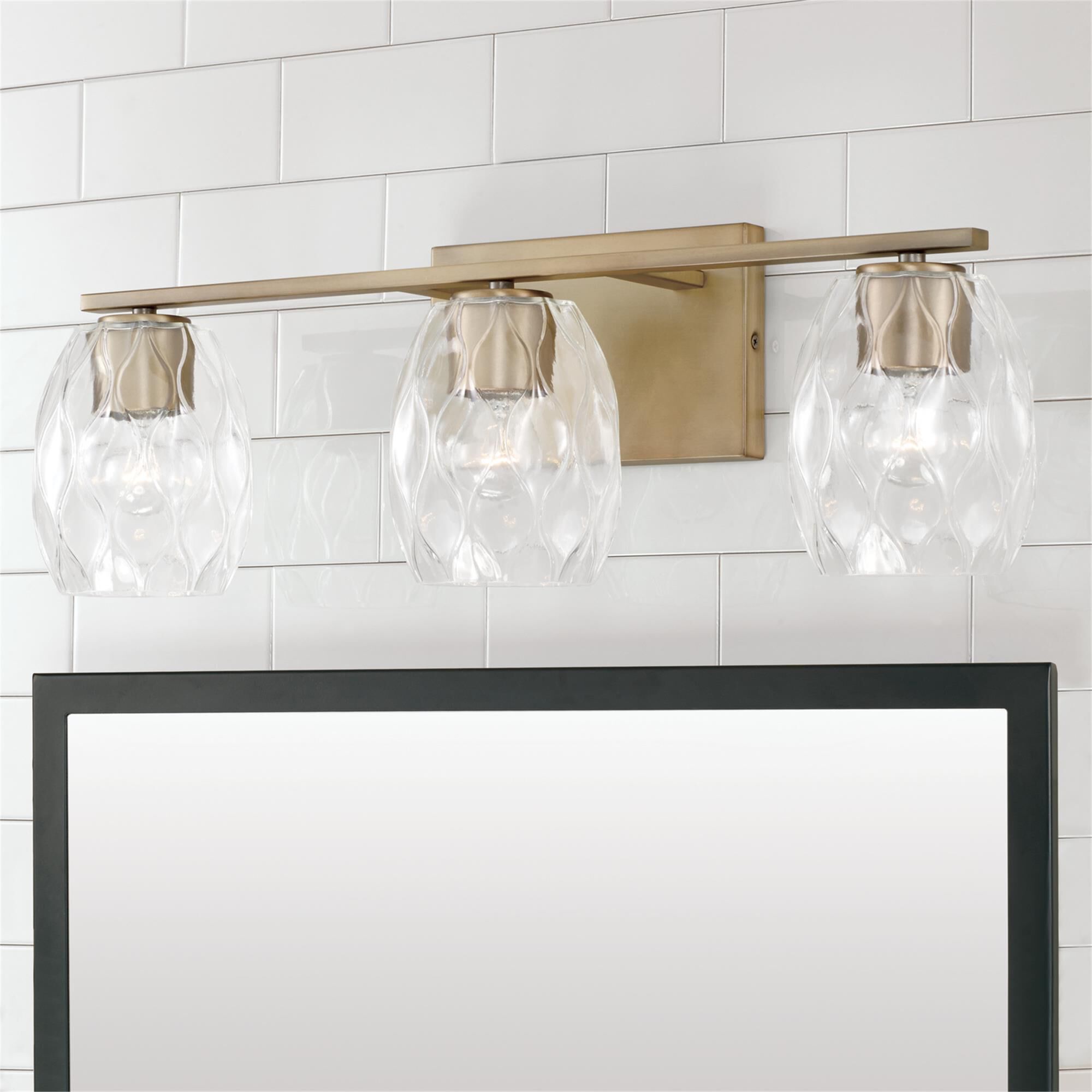 Shown in Aged Brass finish and Wavy Embossed glass