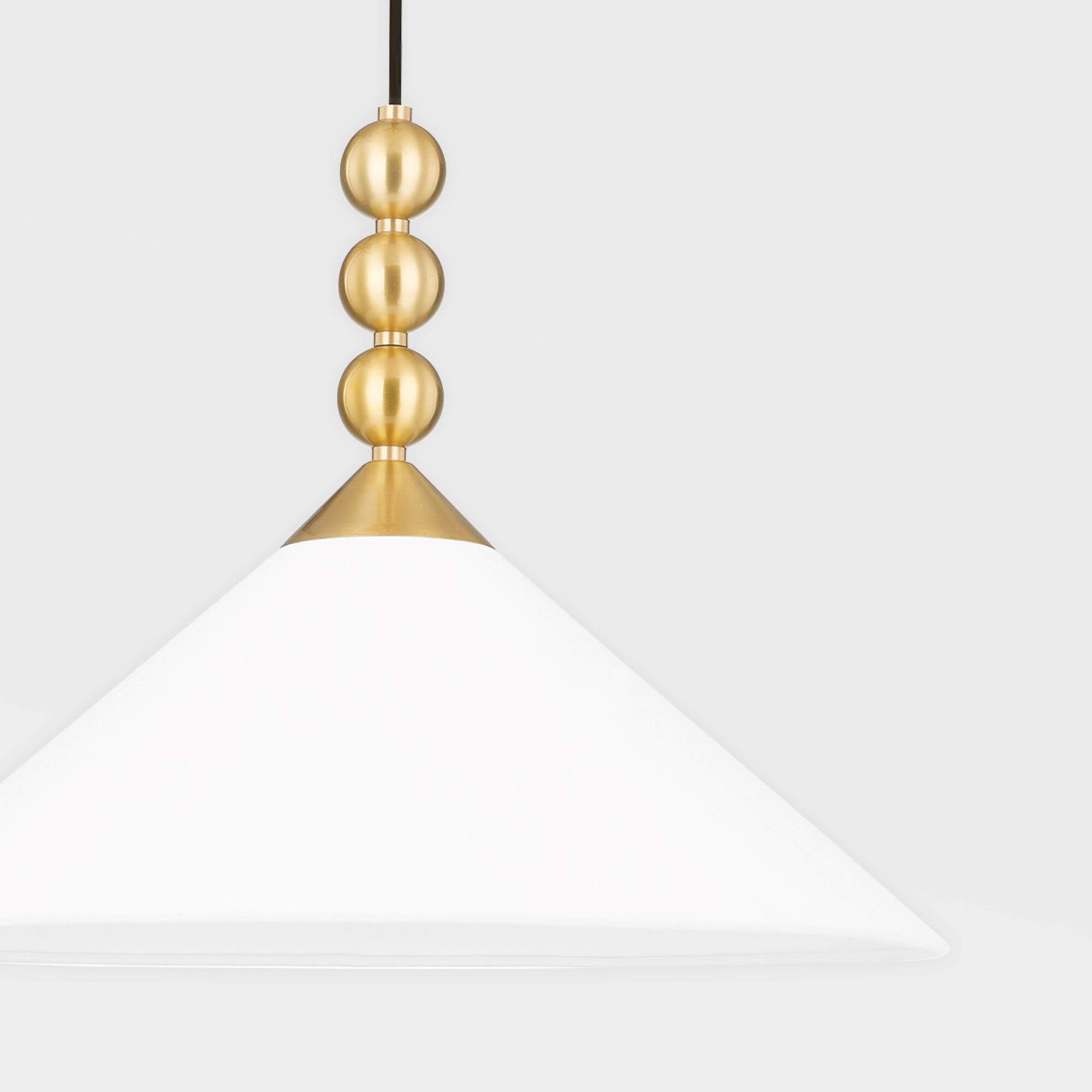 Shown in Aged Brass finish and White Linen shade