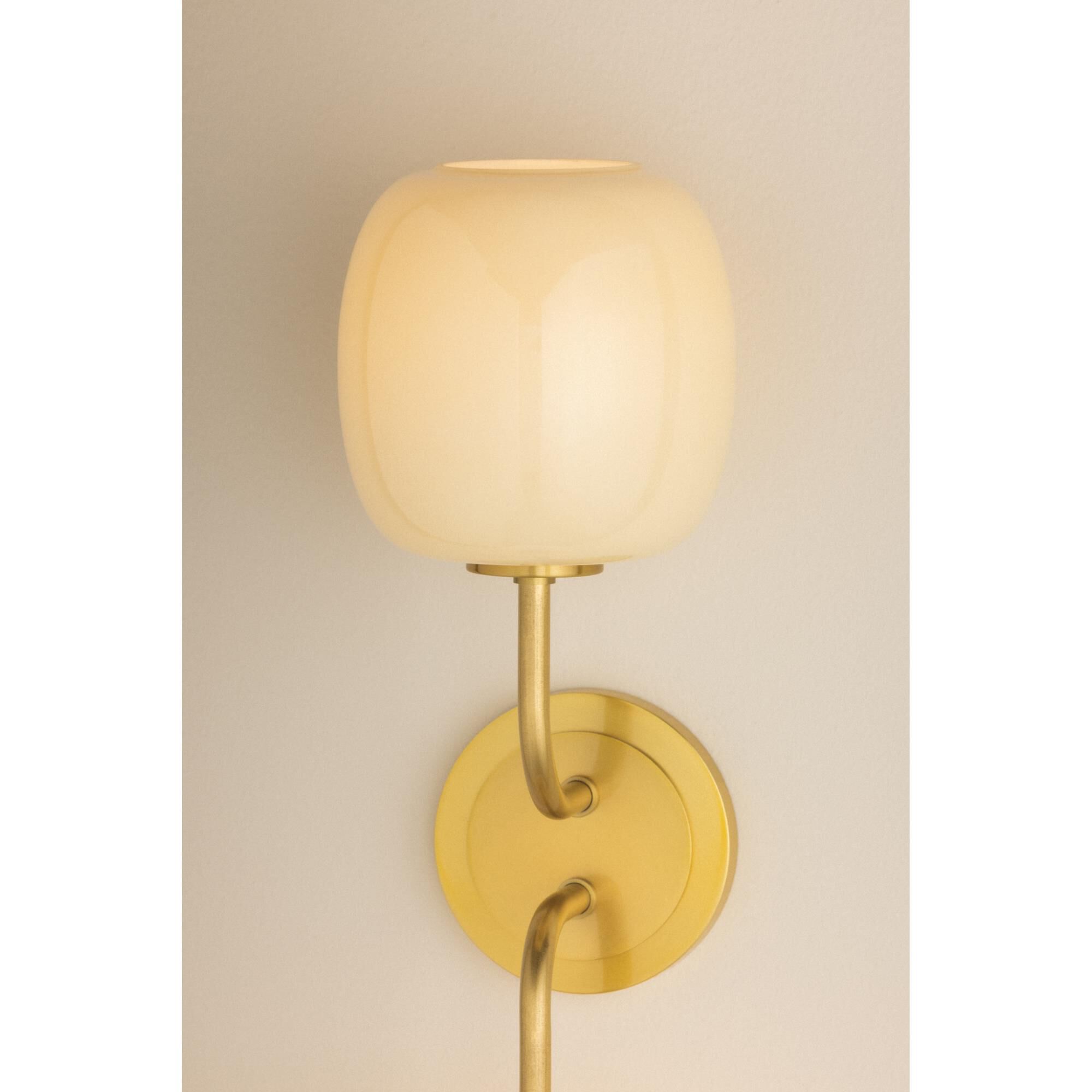 Shown in Aged Brass finish and Cream Opal glass