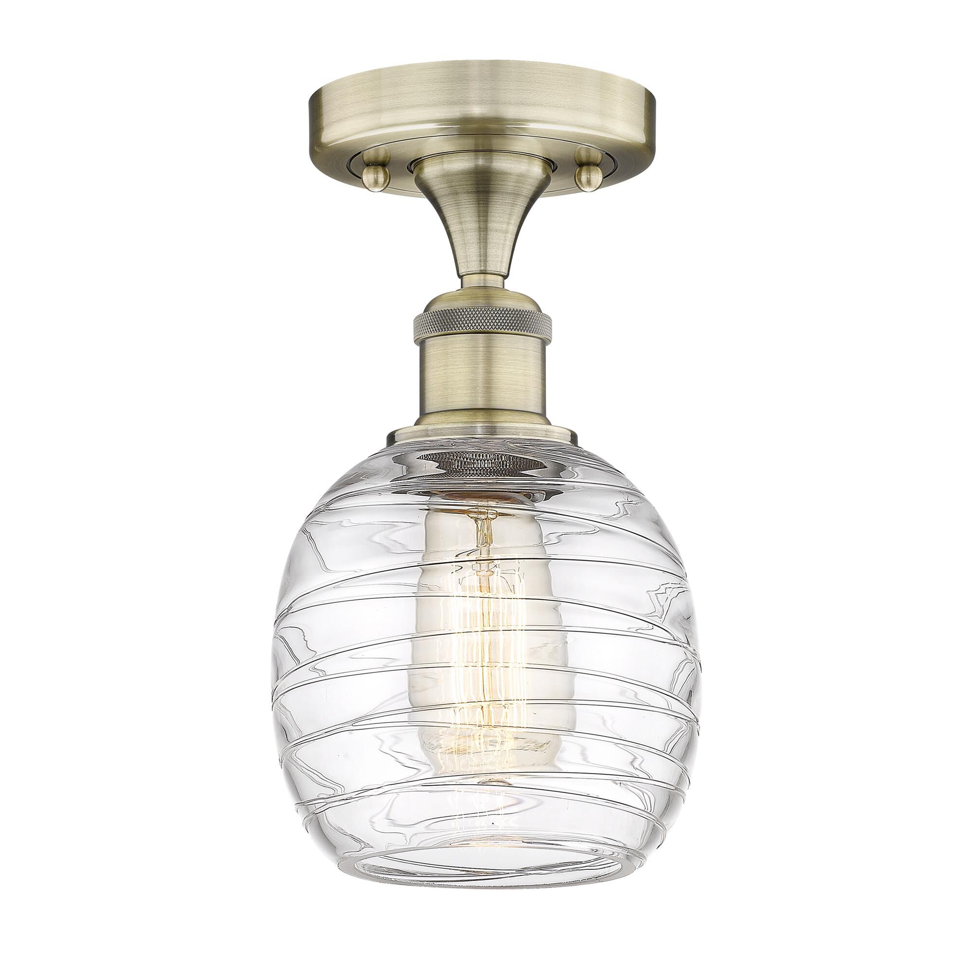 Shown in Antique Brass finish and Deco Swirl glass