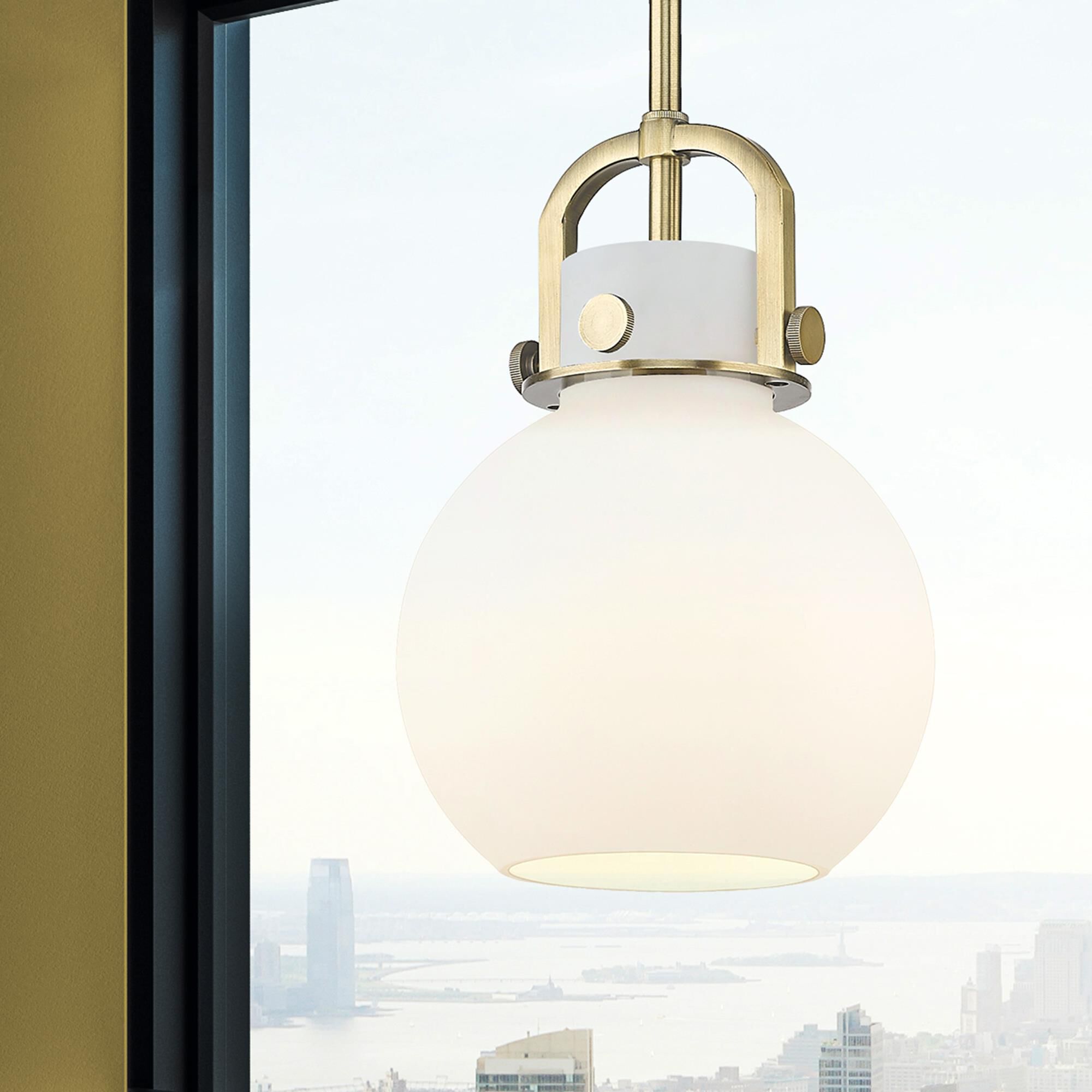 Shown in Brushed Brass finish and Matte White glass