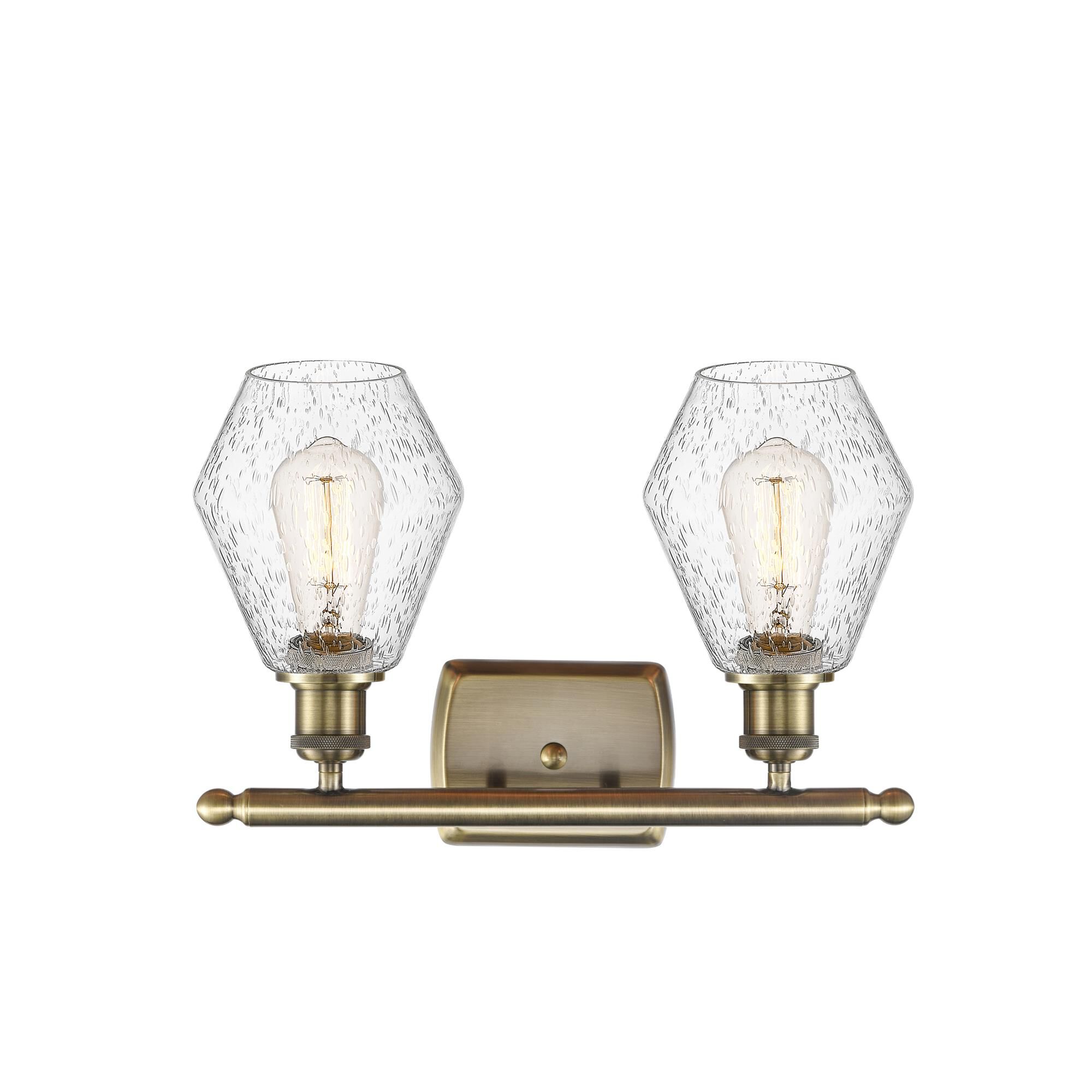 Shown in Antique Brass  finish and Seedy glass