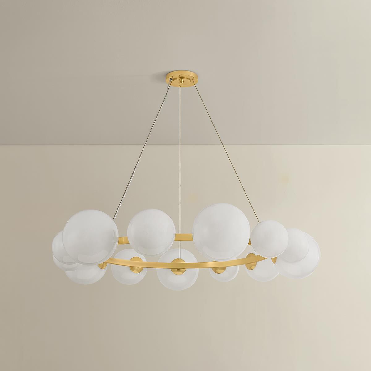 Shown in Aged Brass finish and Seeded Cloud glass