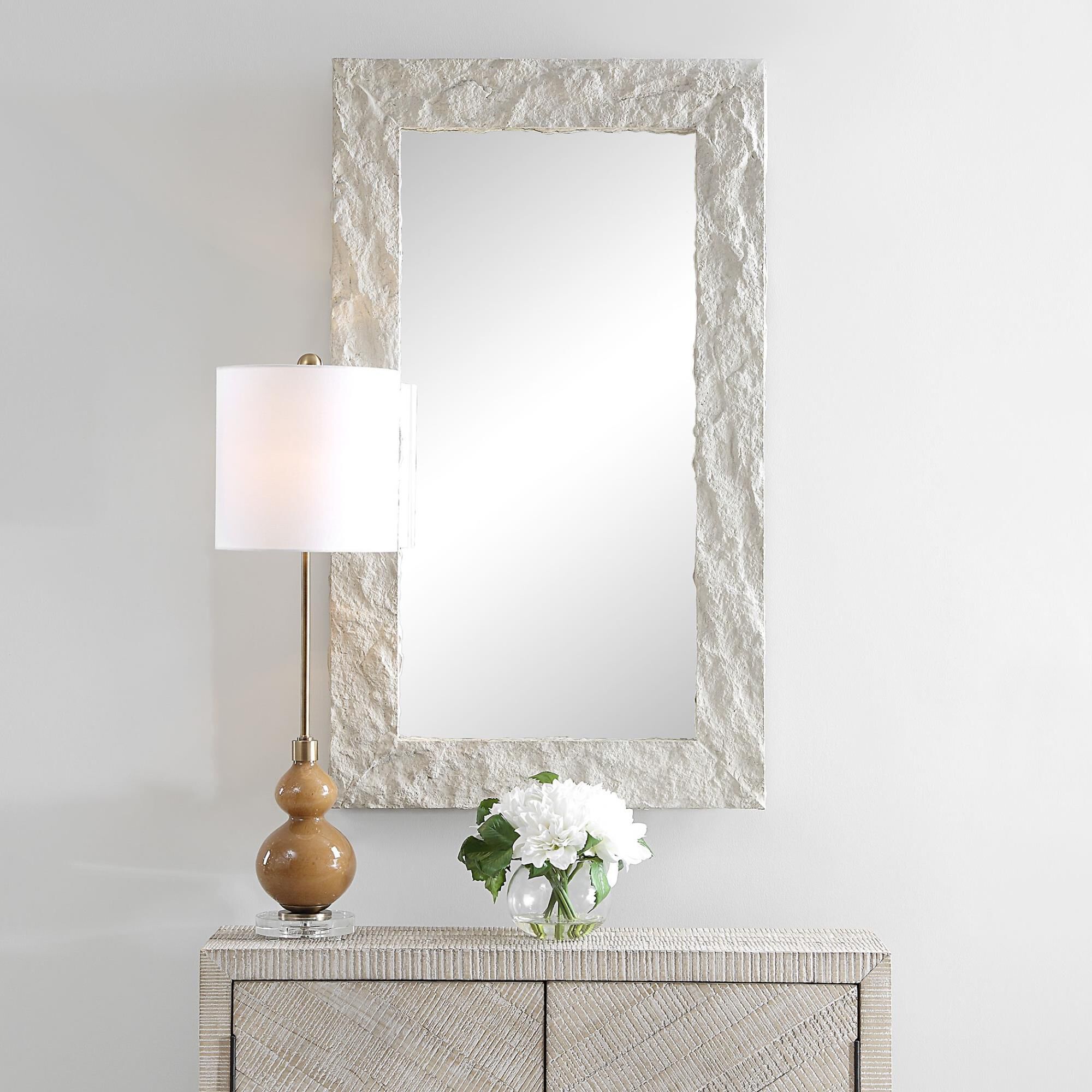 Shown in Elevate Your Decor With Rustic Charm And Upscale Elegance. Our Quarry Rectangle Mirror Showcases A M finish