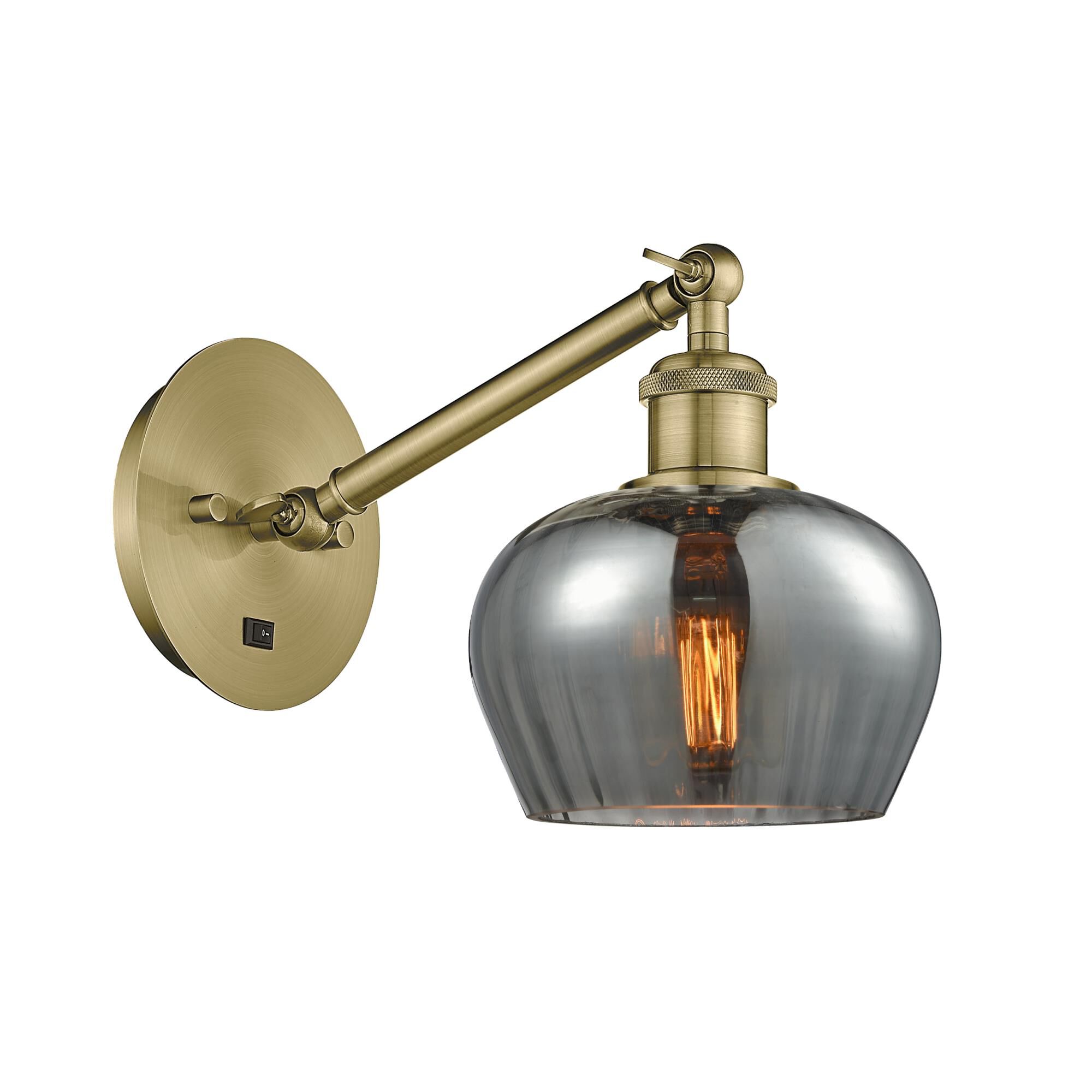 Shown in Antique Brass finish and Plated Smoke Fenton glass