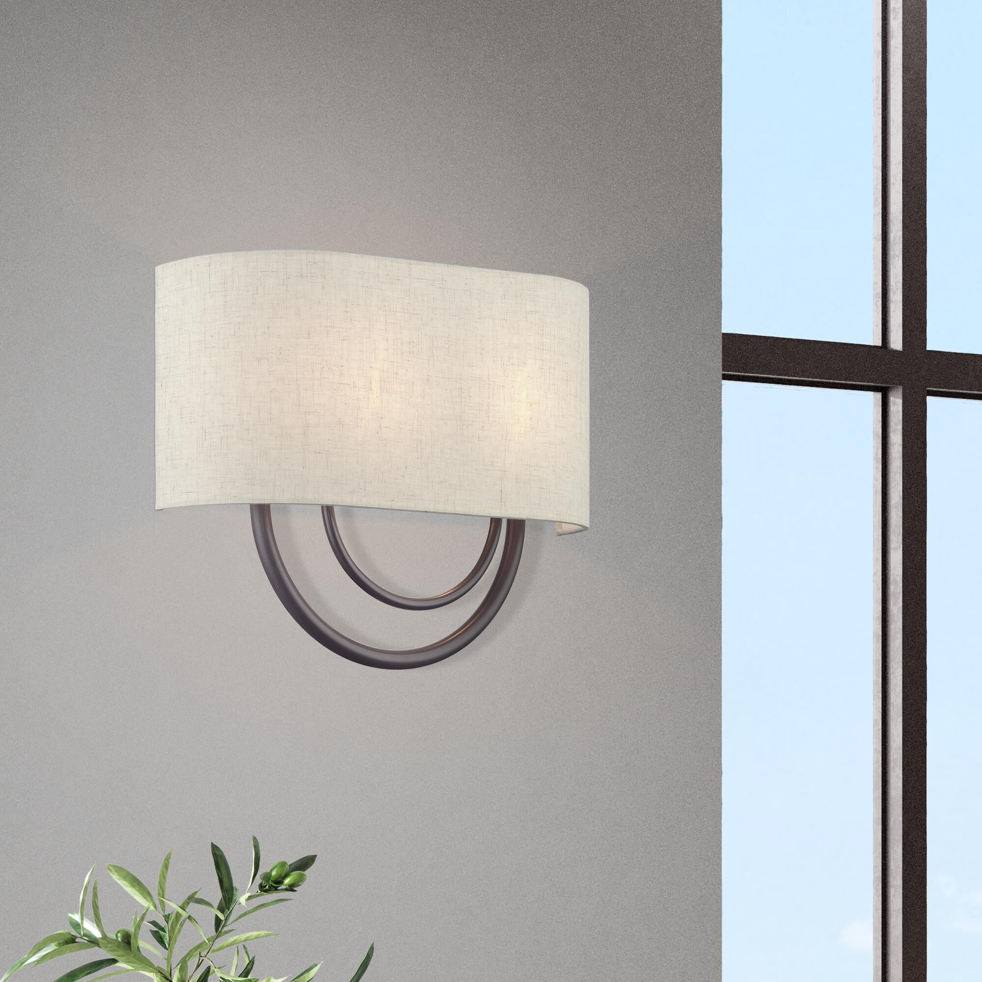 Shown in English Bronze finish and Hand Crafted Oatmeal Color Fabric Hardback with White Fabric Inside shade