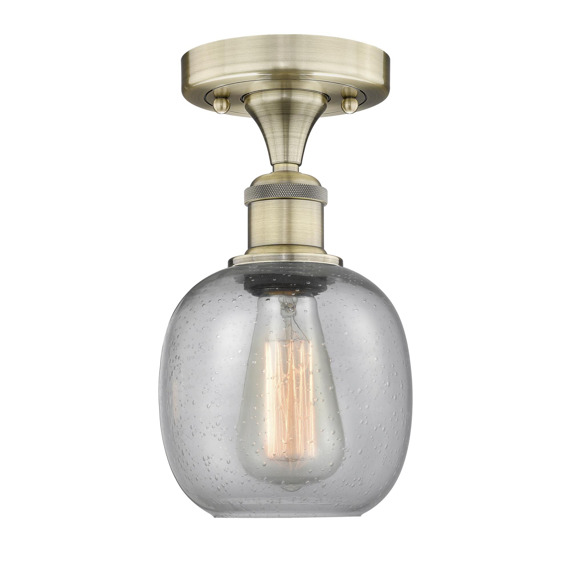 Shown in Antique Brass finish and Seedy glass