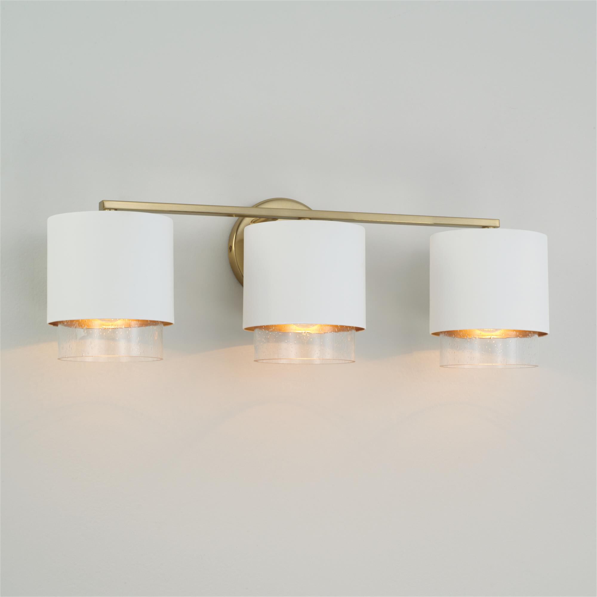Shown in Matte Brass and White finish and Clear Seeded glass and Metal with Brass Interior shade